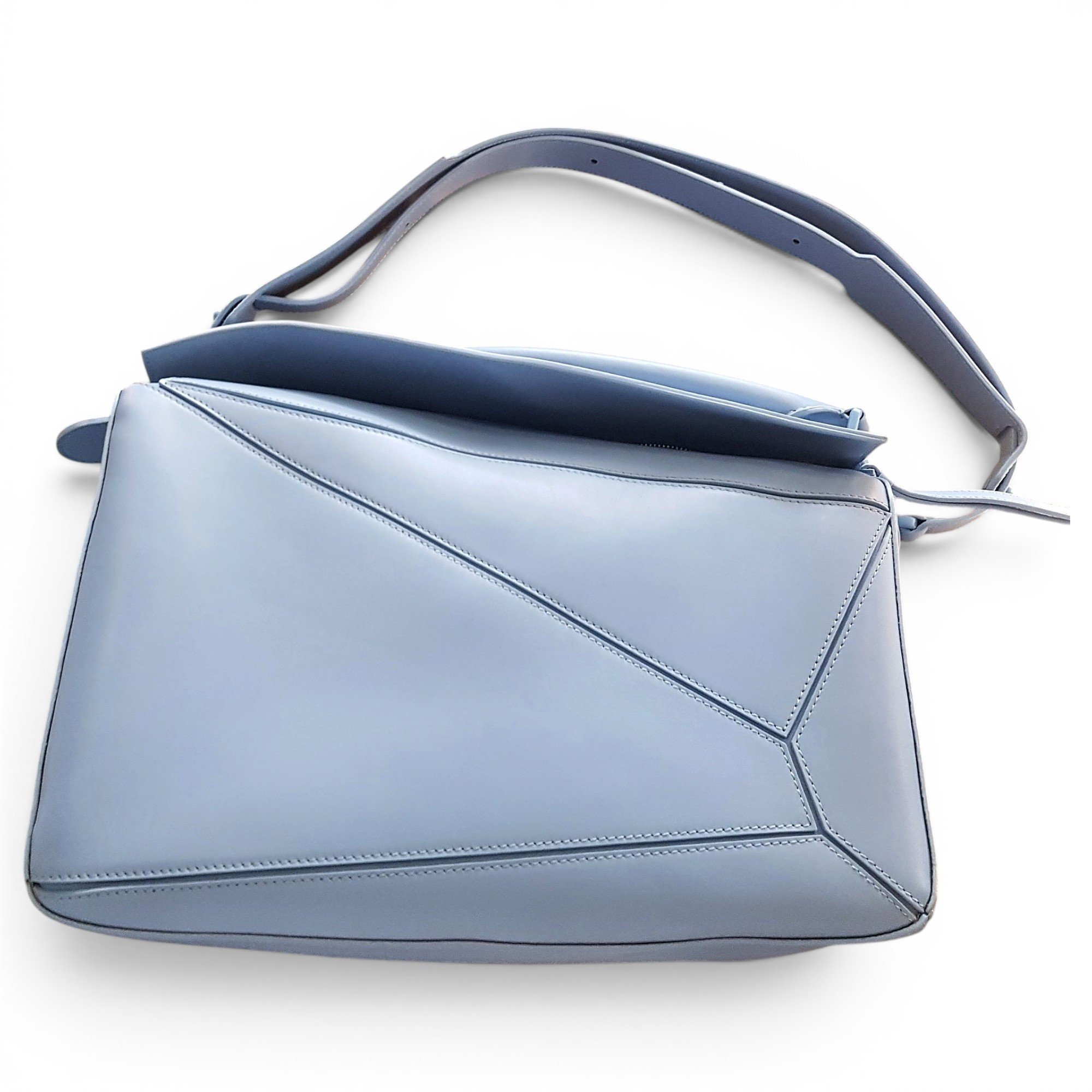 Puzzle leather clutch bag