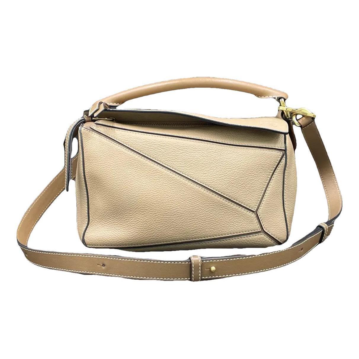 Puzzle leather handbag