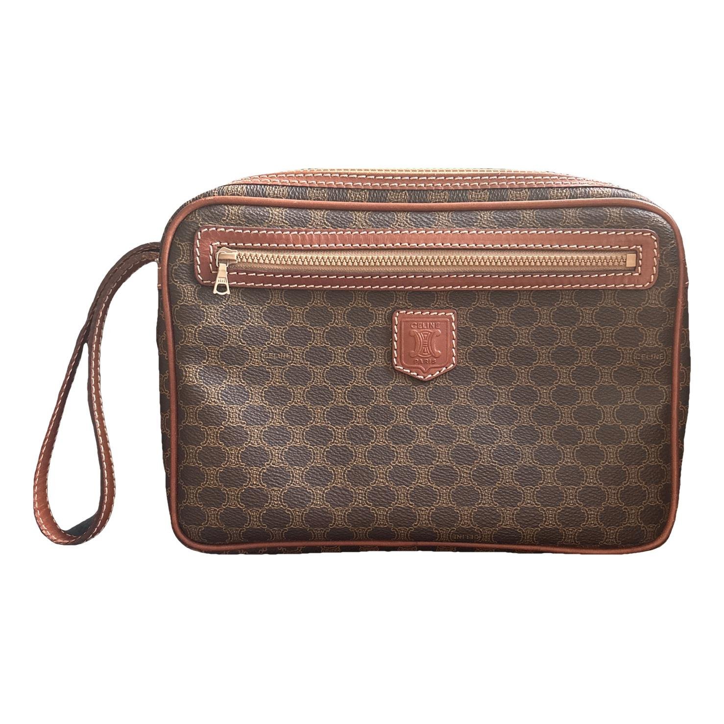 Triomphe Vintage leather clutch bag