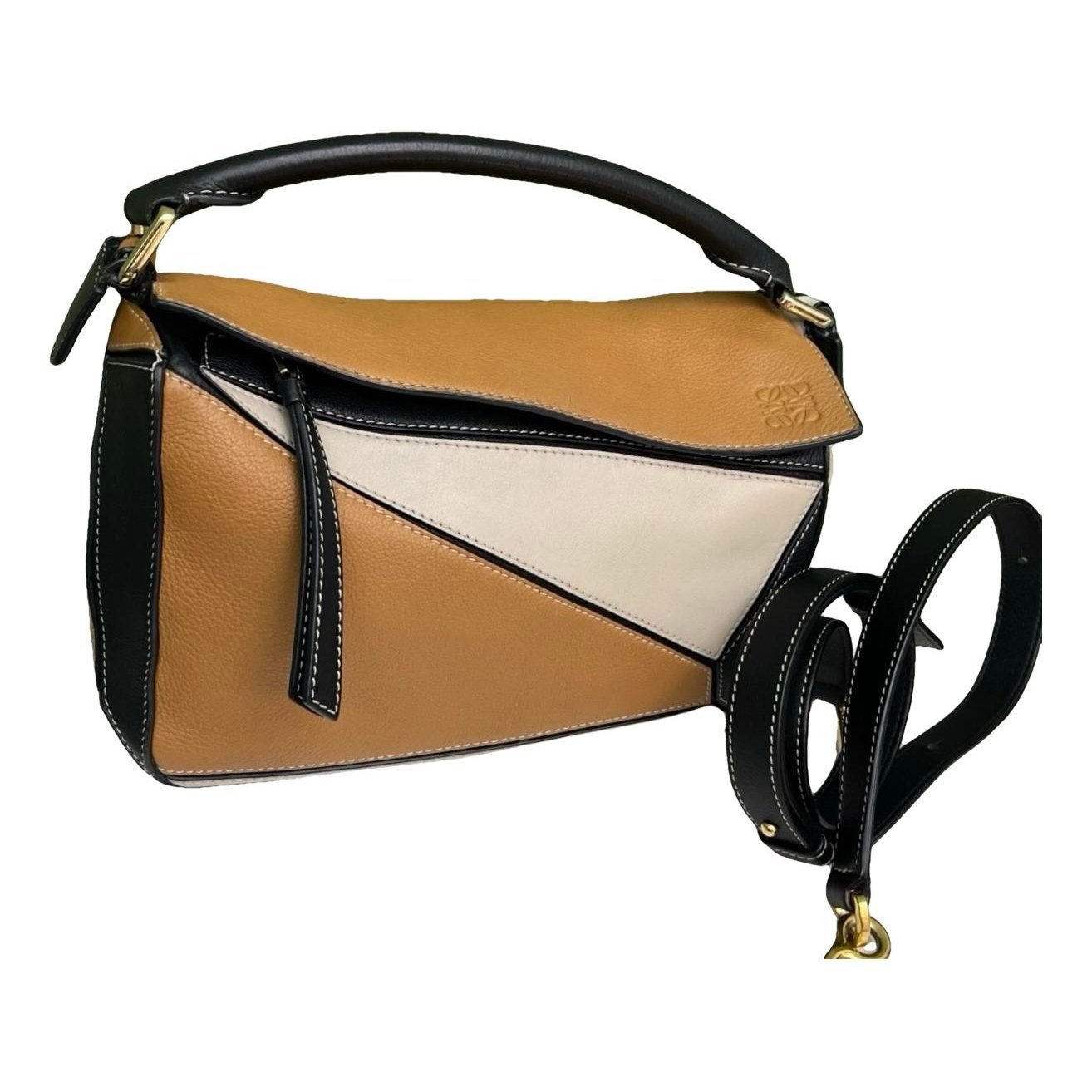 Puzzle leather handbag