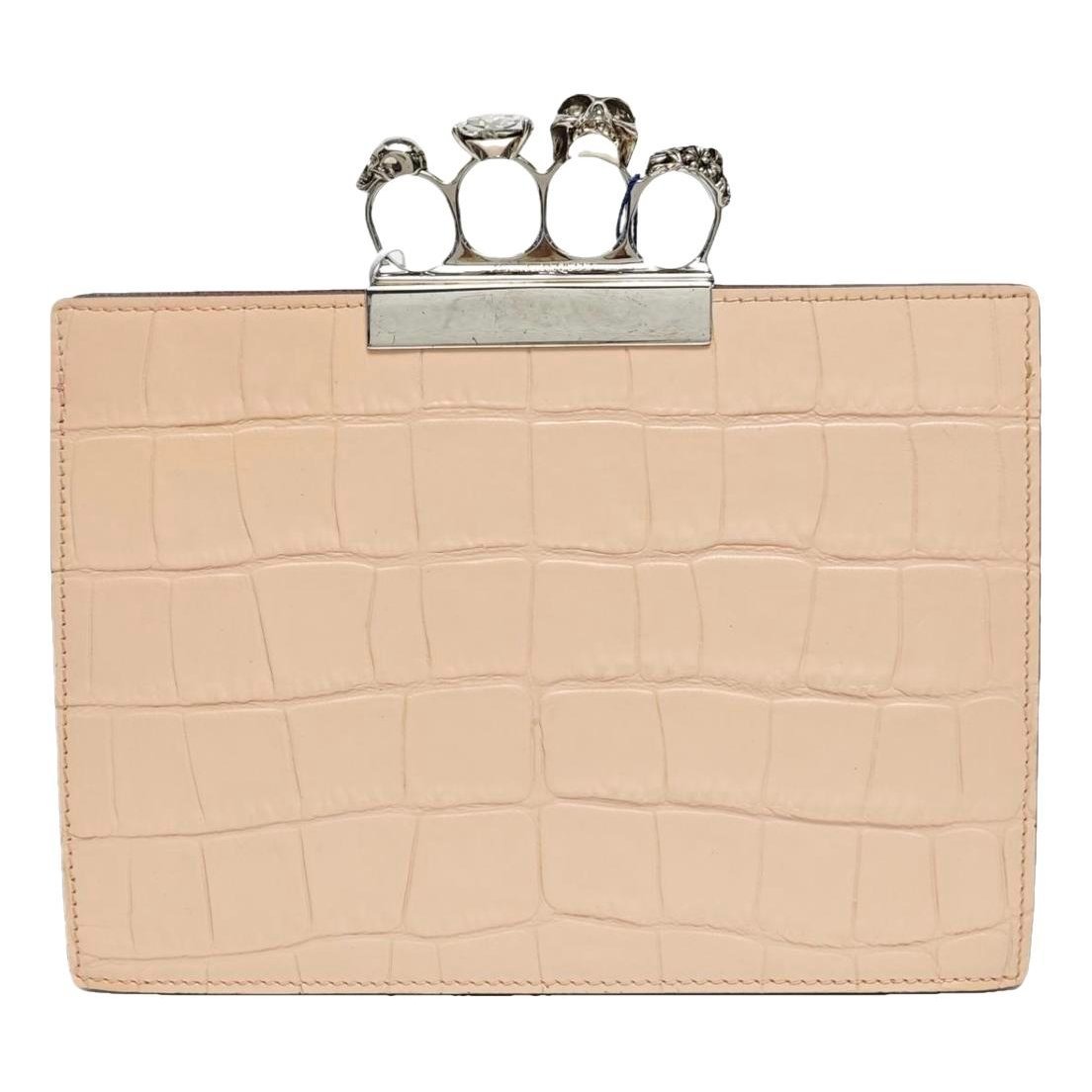 Knuckle leather clutch bag