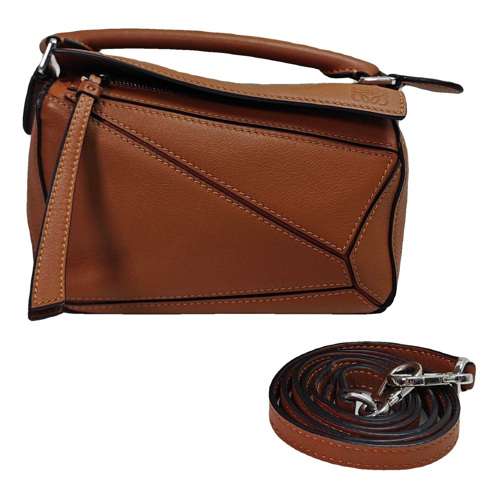 Puzzle leather handbag