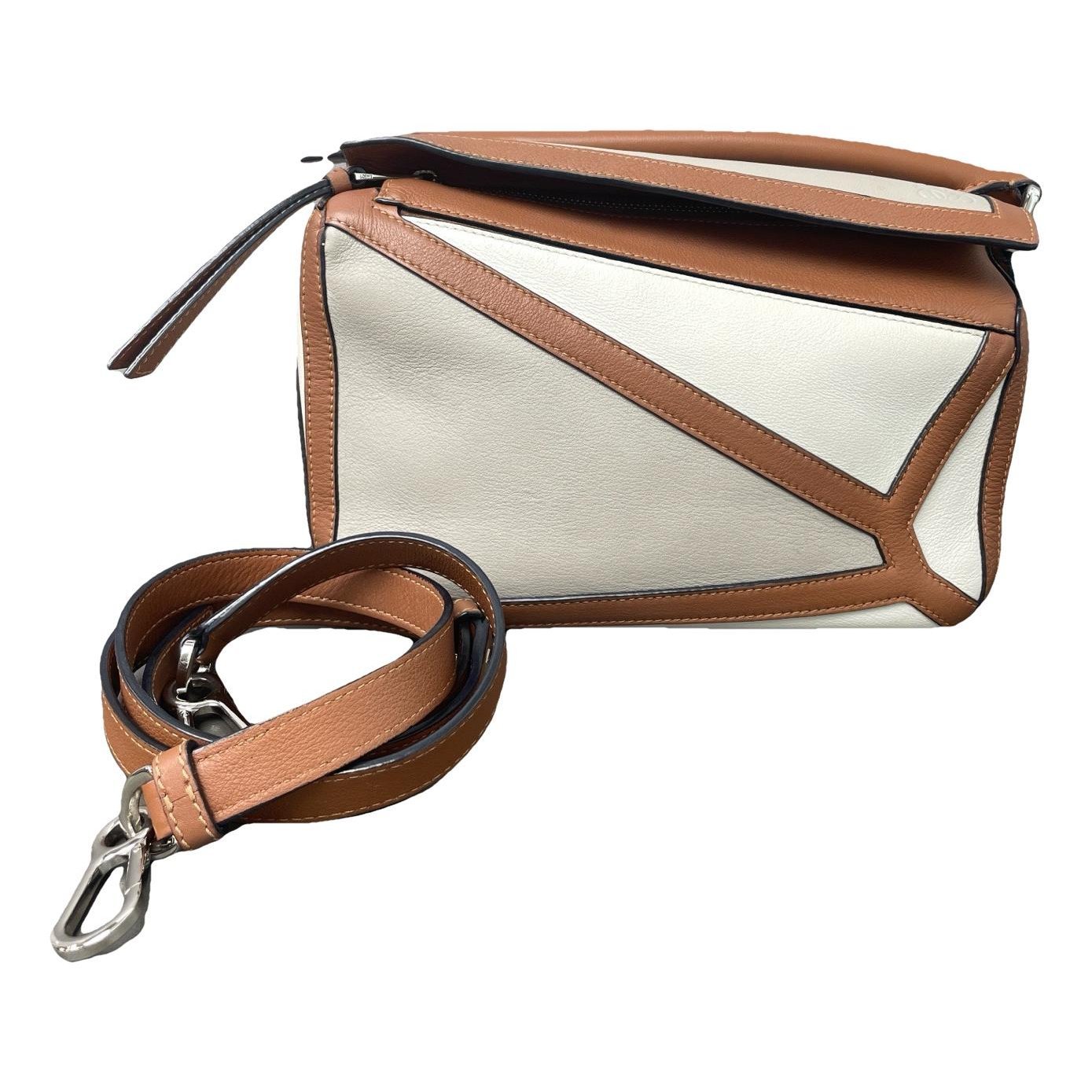 Puzzle leather handbag