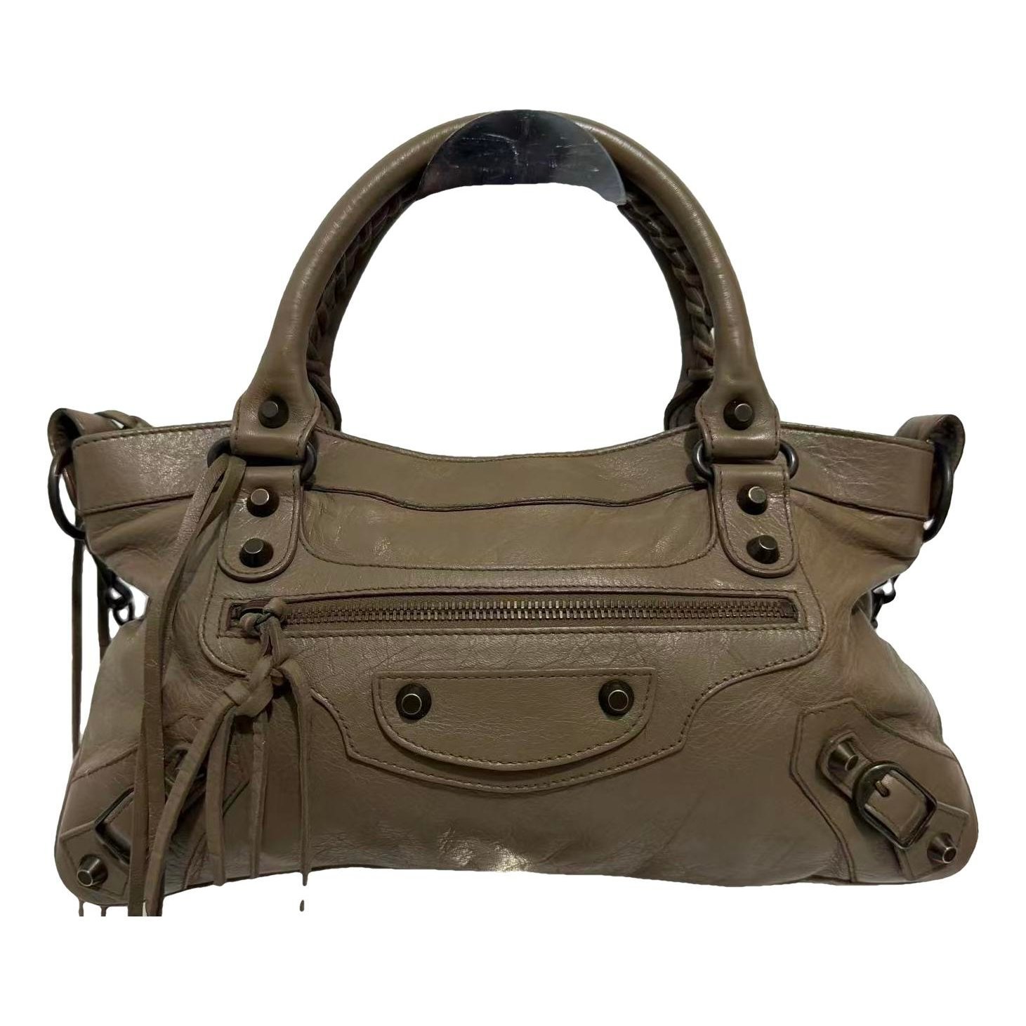 First leather handbag