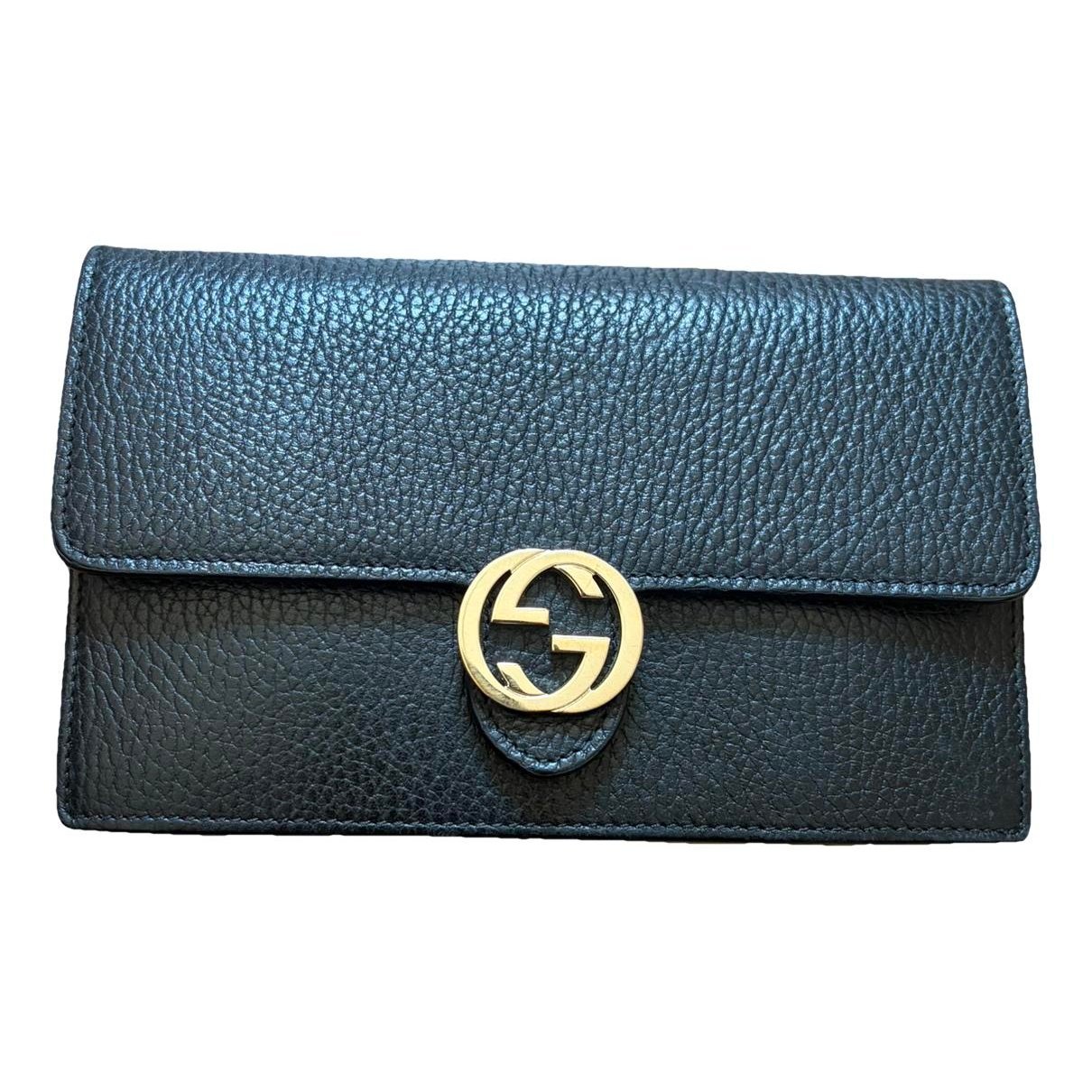 Interlocking leather clutch bag