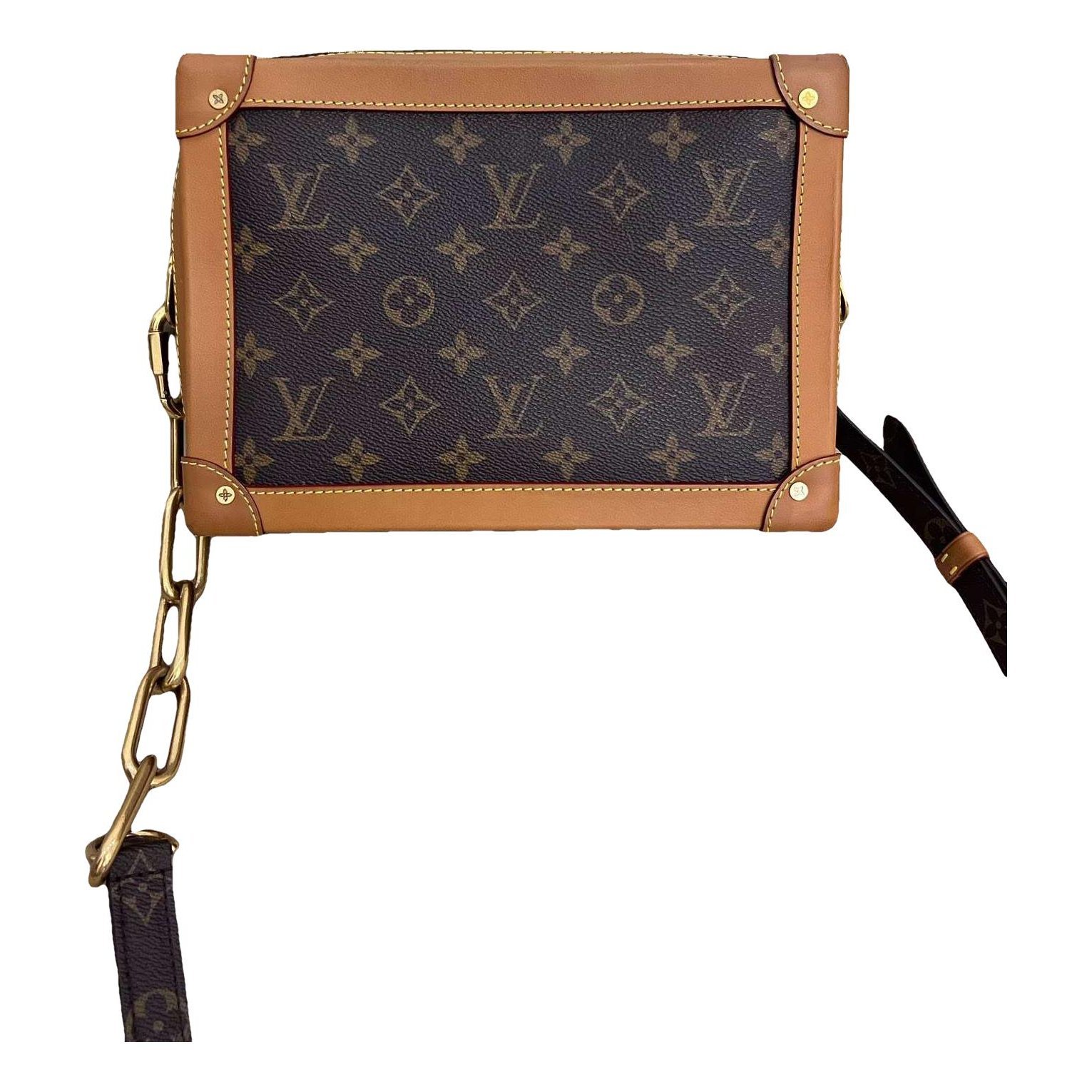 Pochette Trunk leather handbag