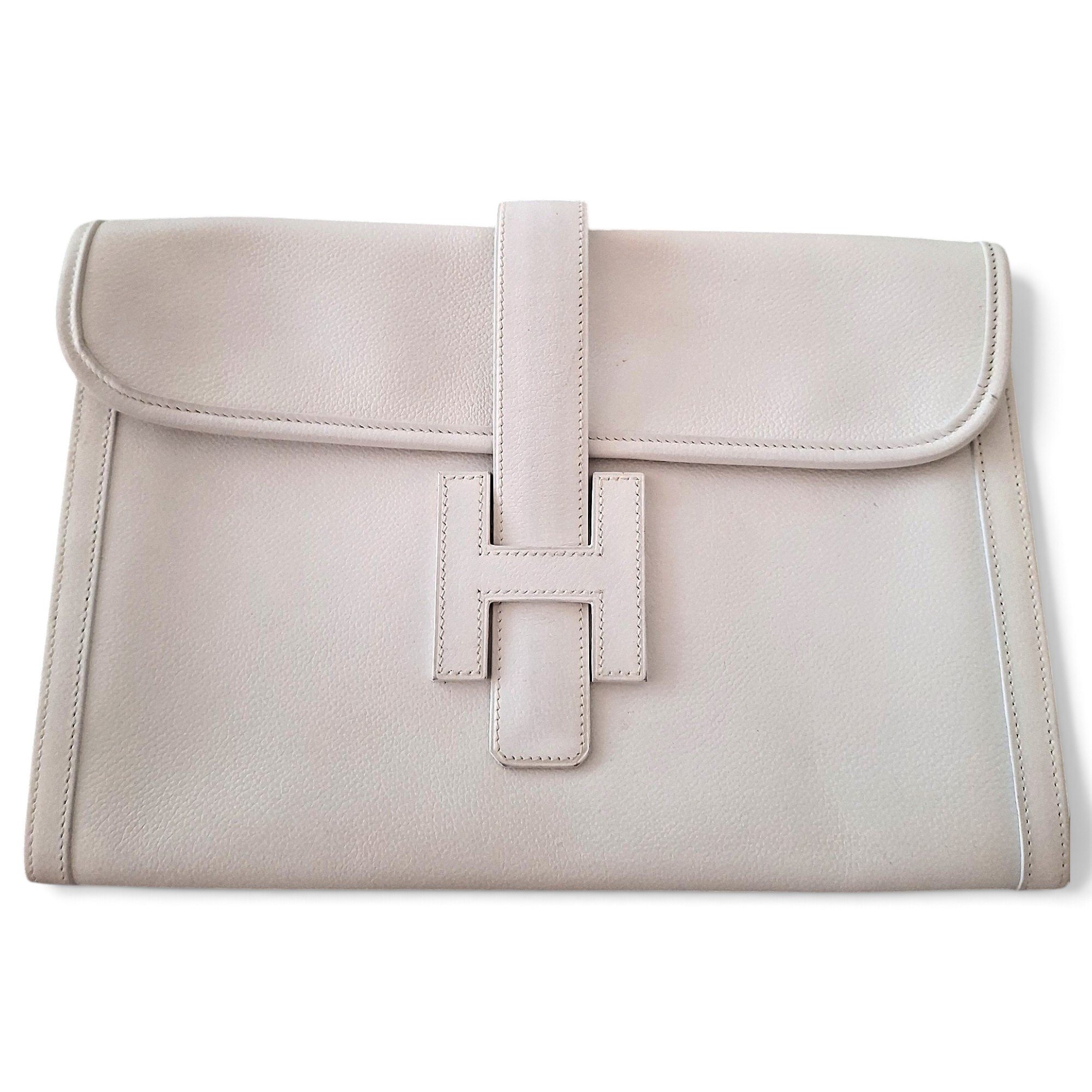 Jige leather clutch bag