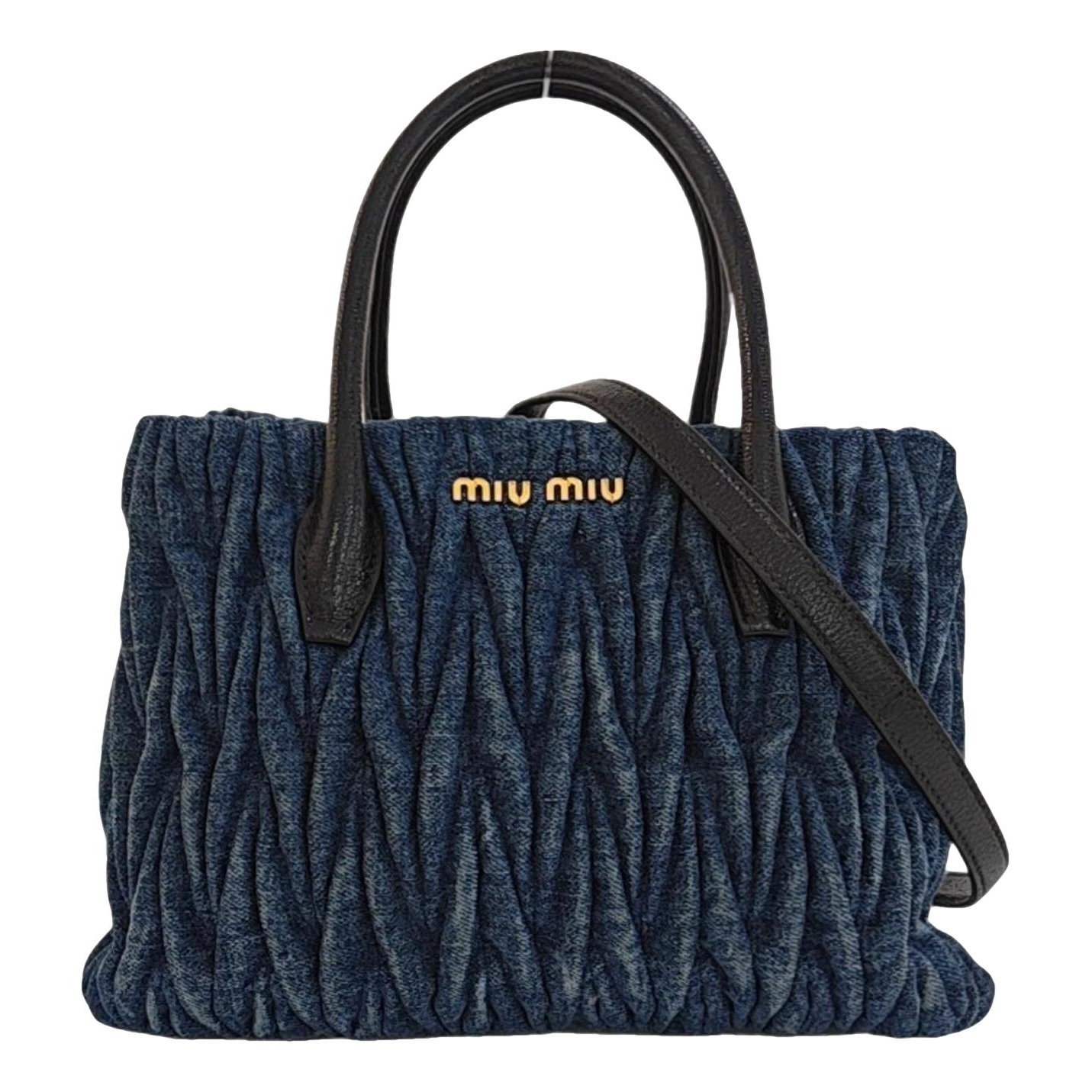 Matelassé cloth handbag