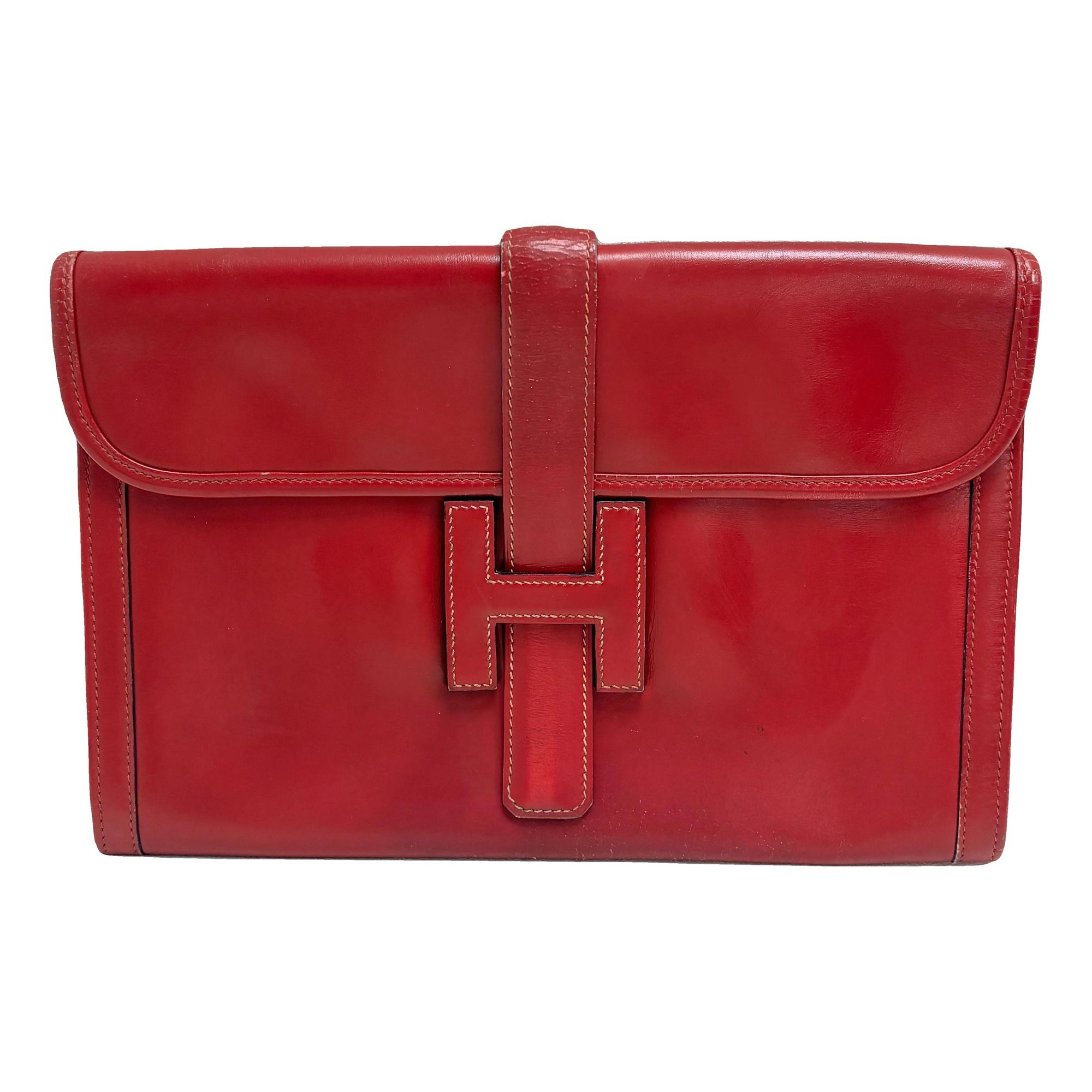 Jige leather clutch bag