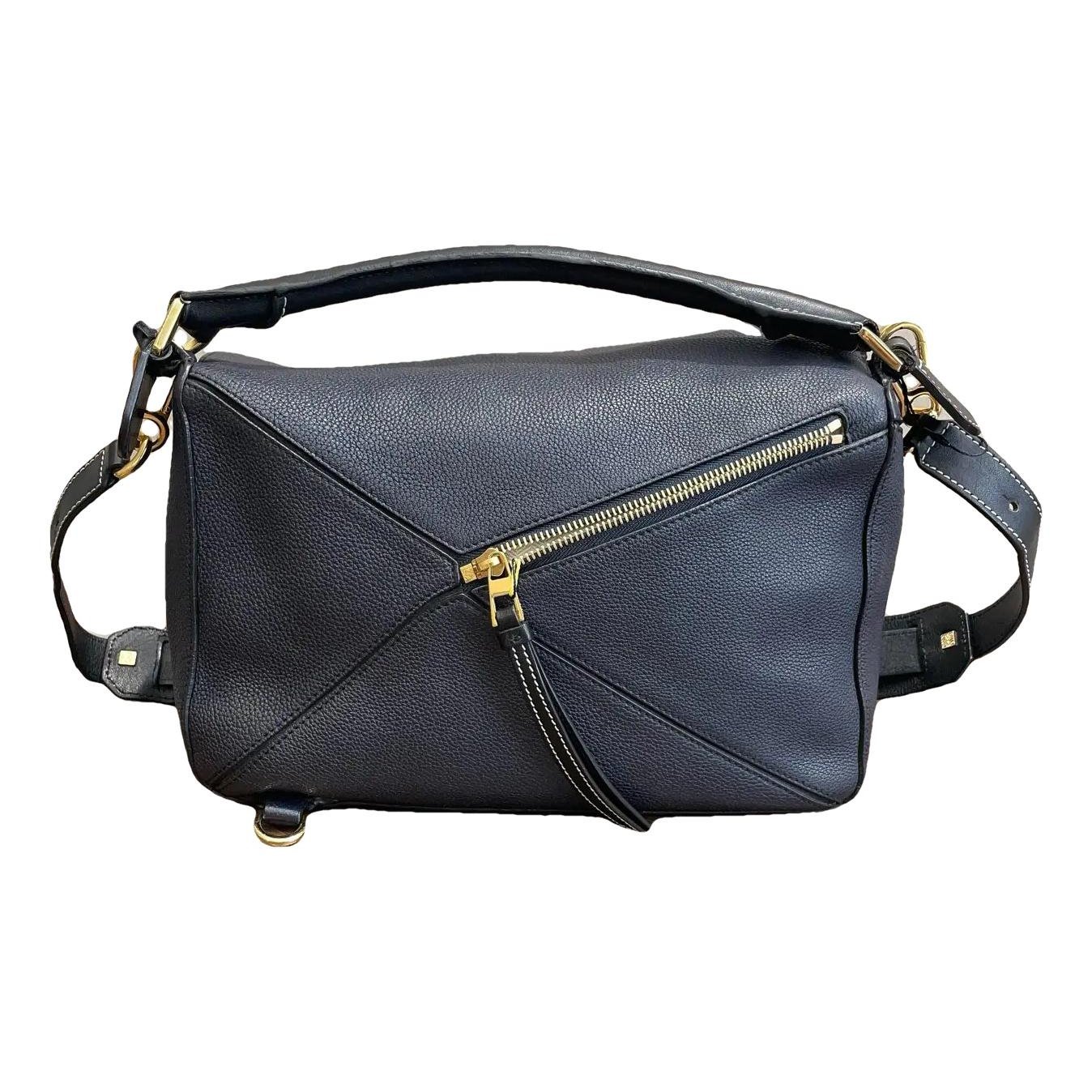 Puzzle leather handbag
