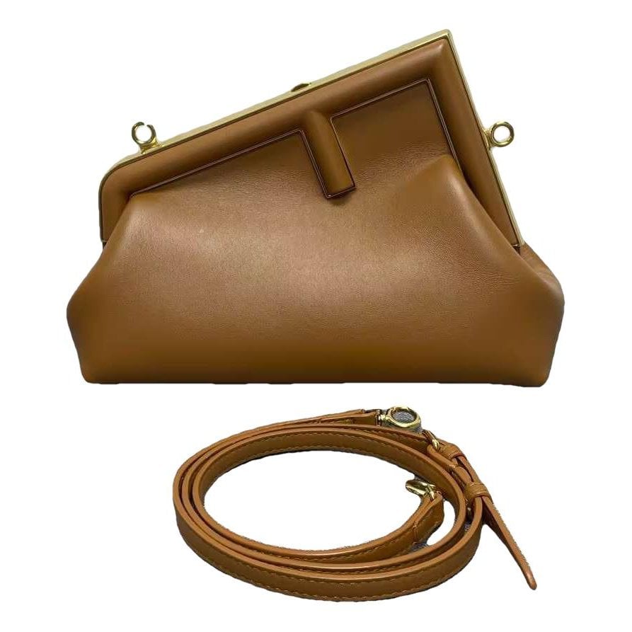 First leather handbag