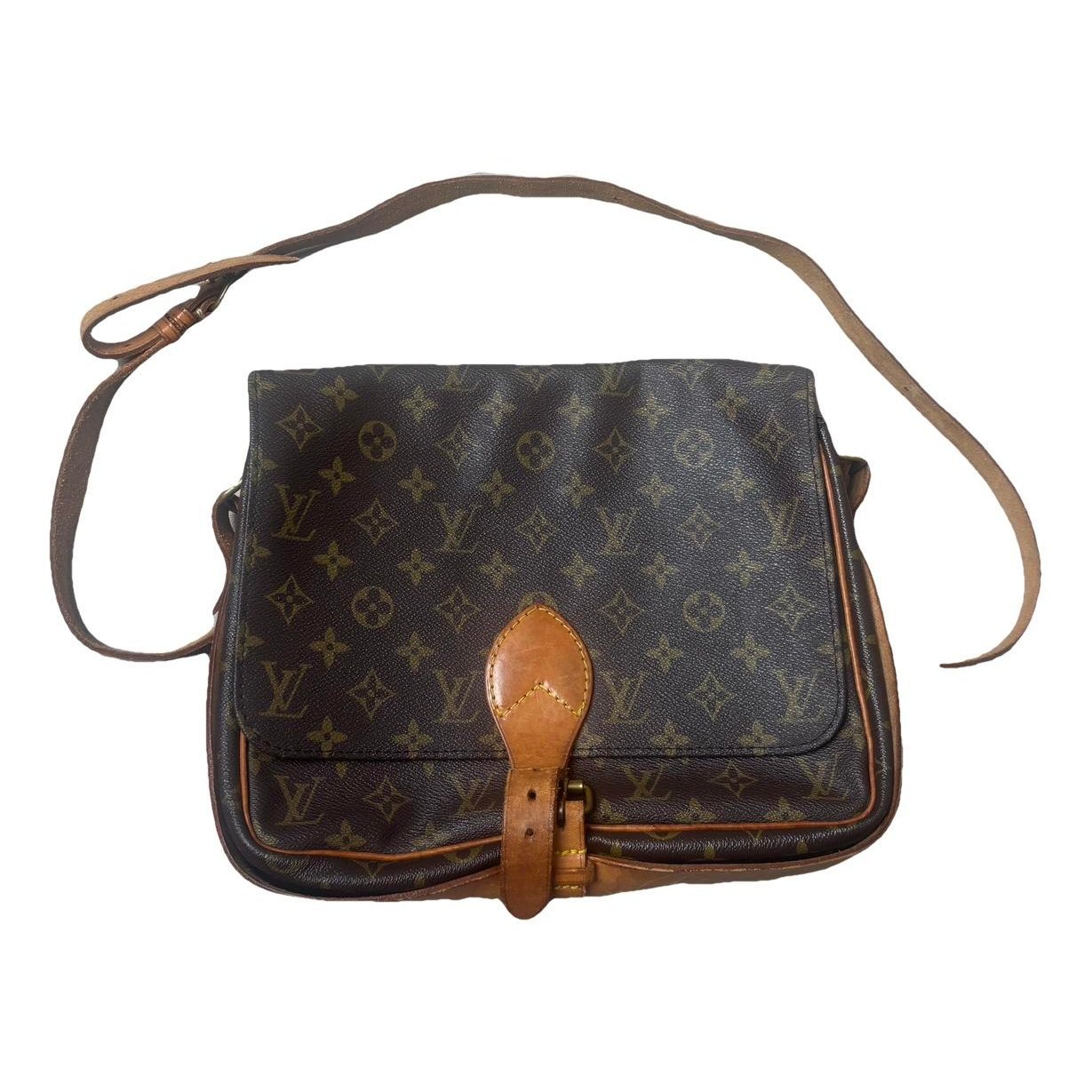 Cartouchière patent leather crossbody bag