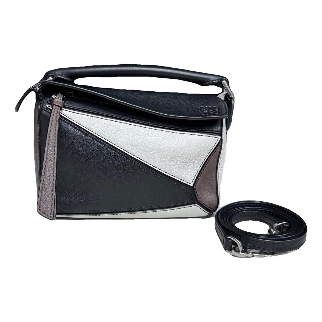Puzzle leather handbag