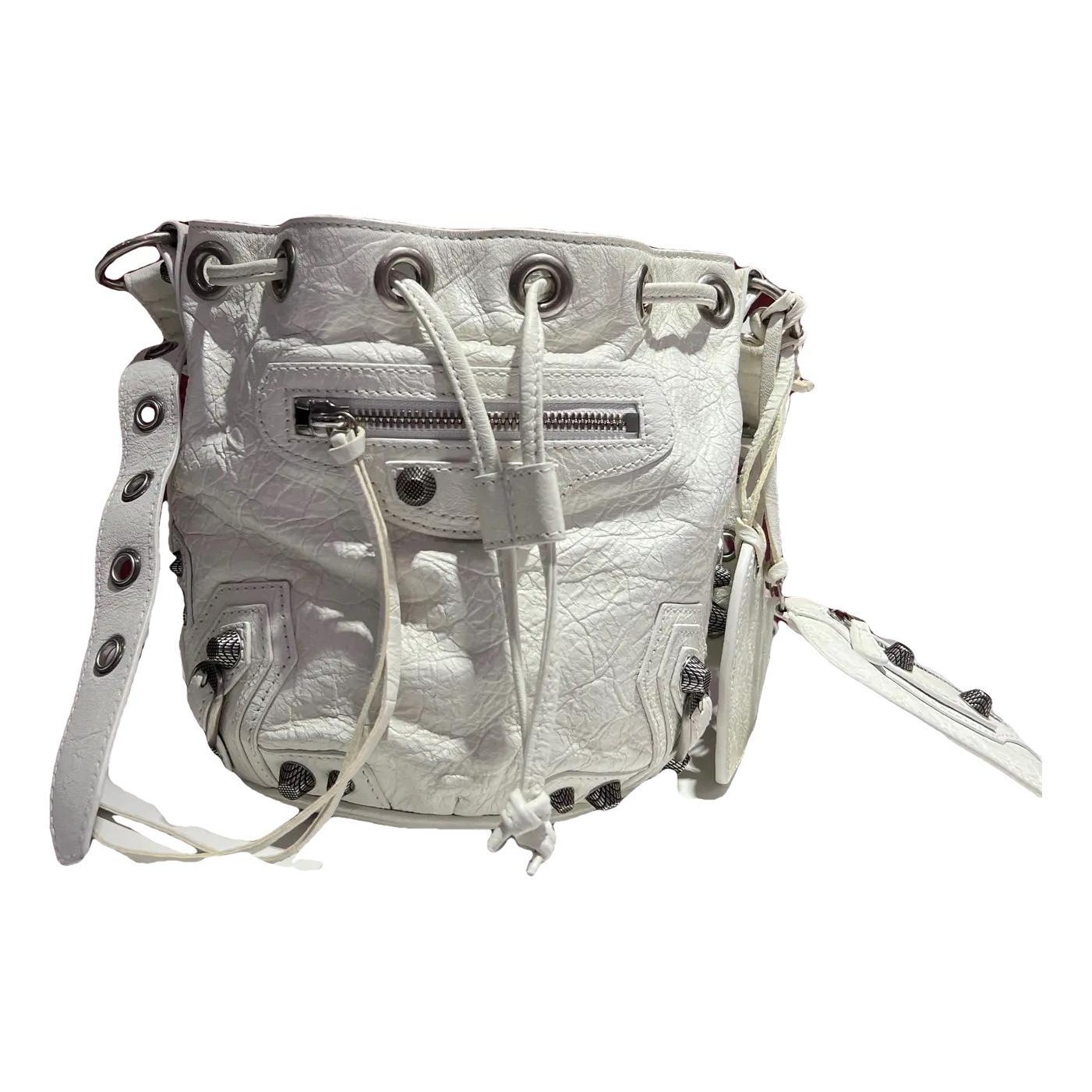Pompon leather handbag