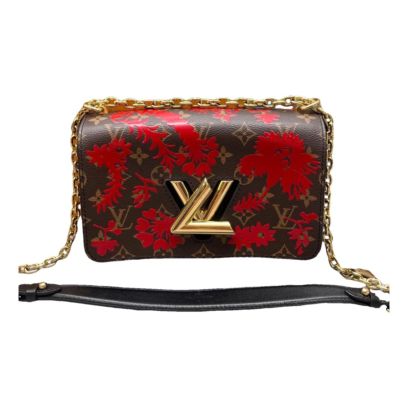 Twist vinyl crossbody bag