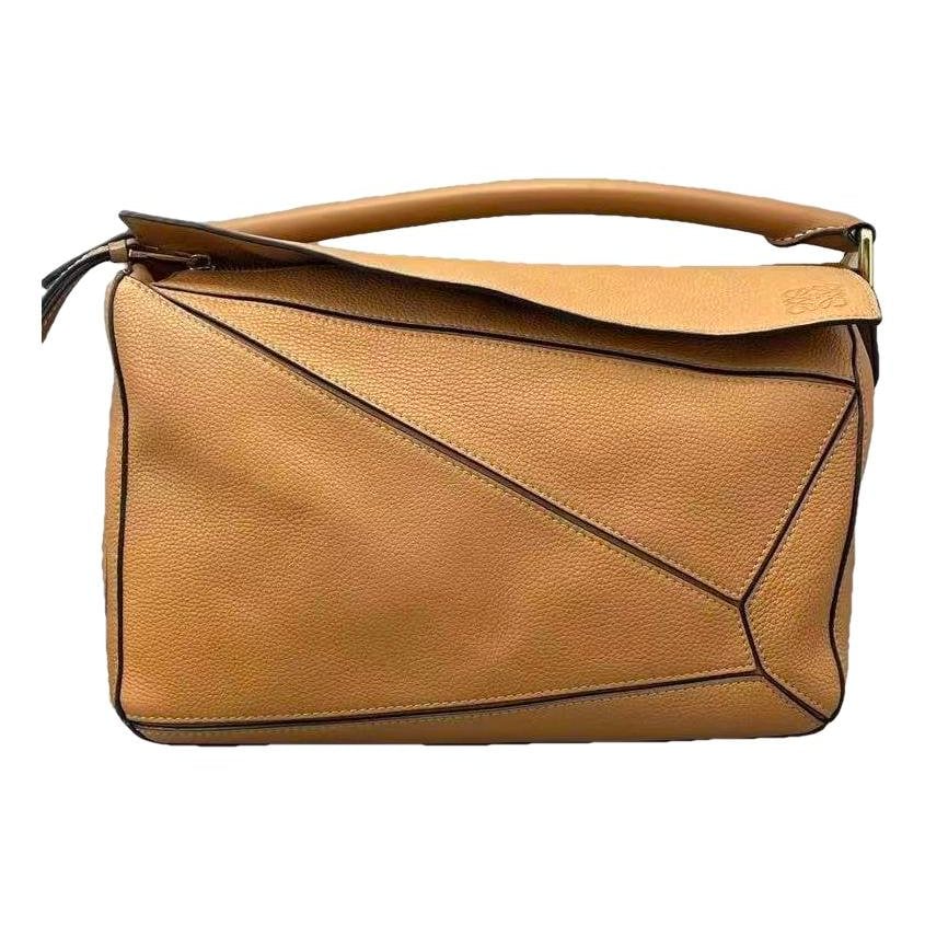 Puzzle leather handbag