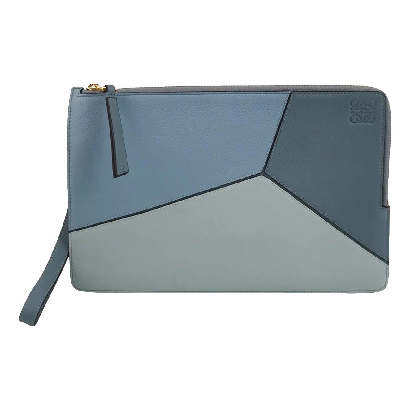 Puzzle leather clutch bag