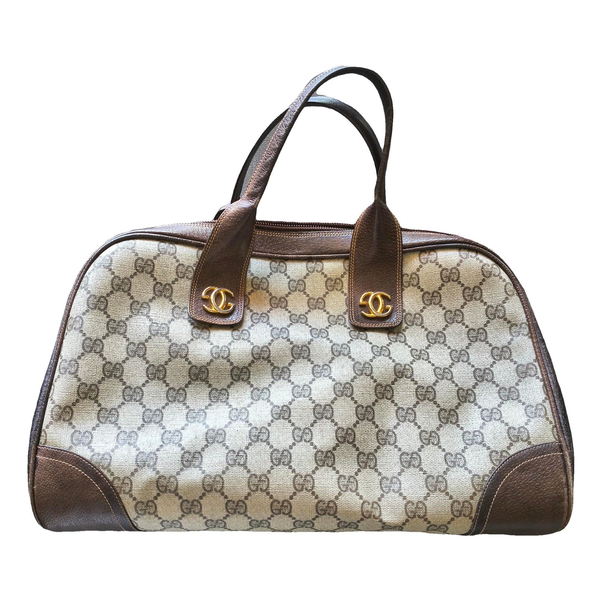 Ophidia Dome Top Handle cloth handbag