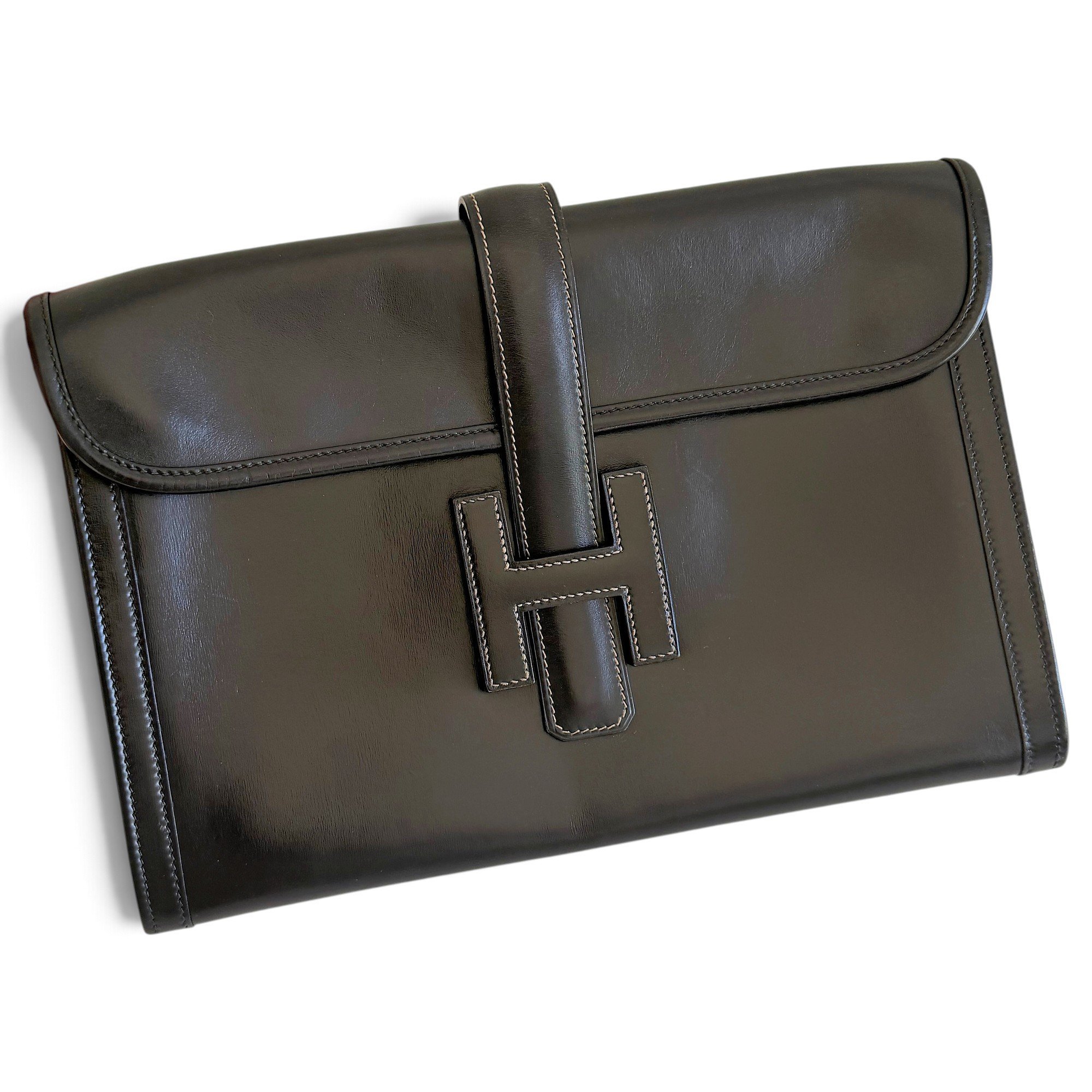 Jige leather clutch bag