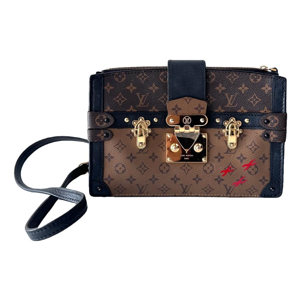 Pochette Trunk leather handbag