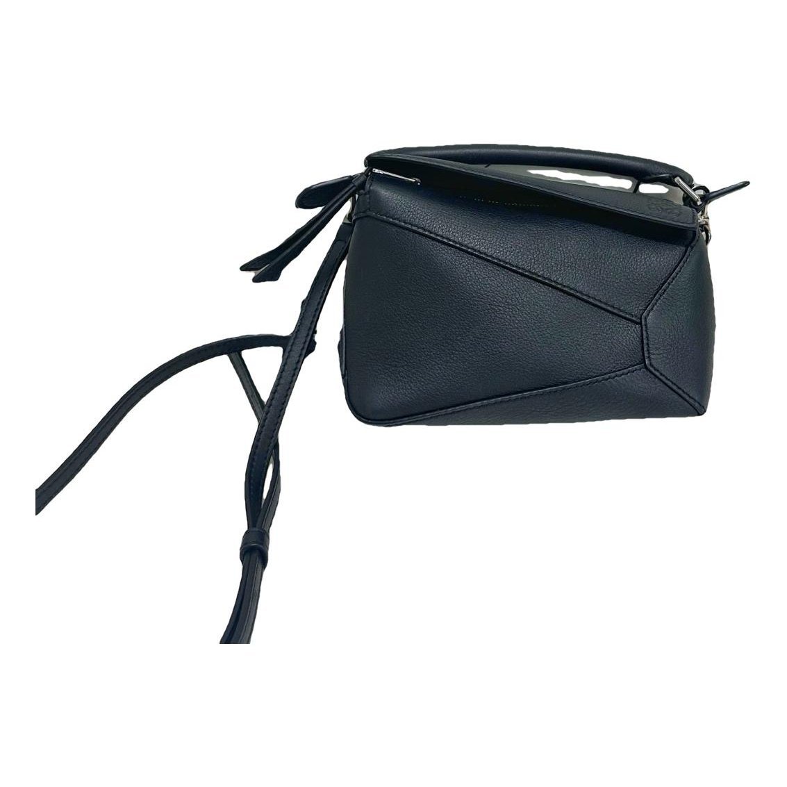 Puzzle leather handbag