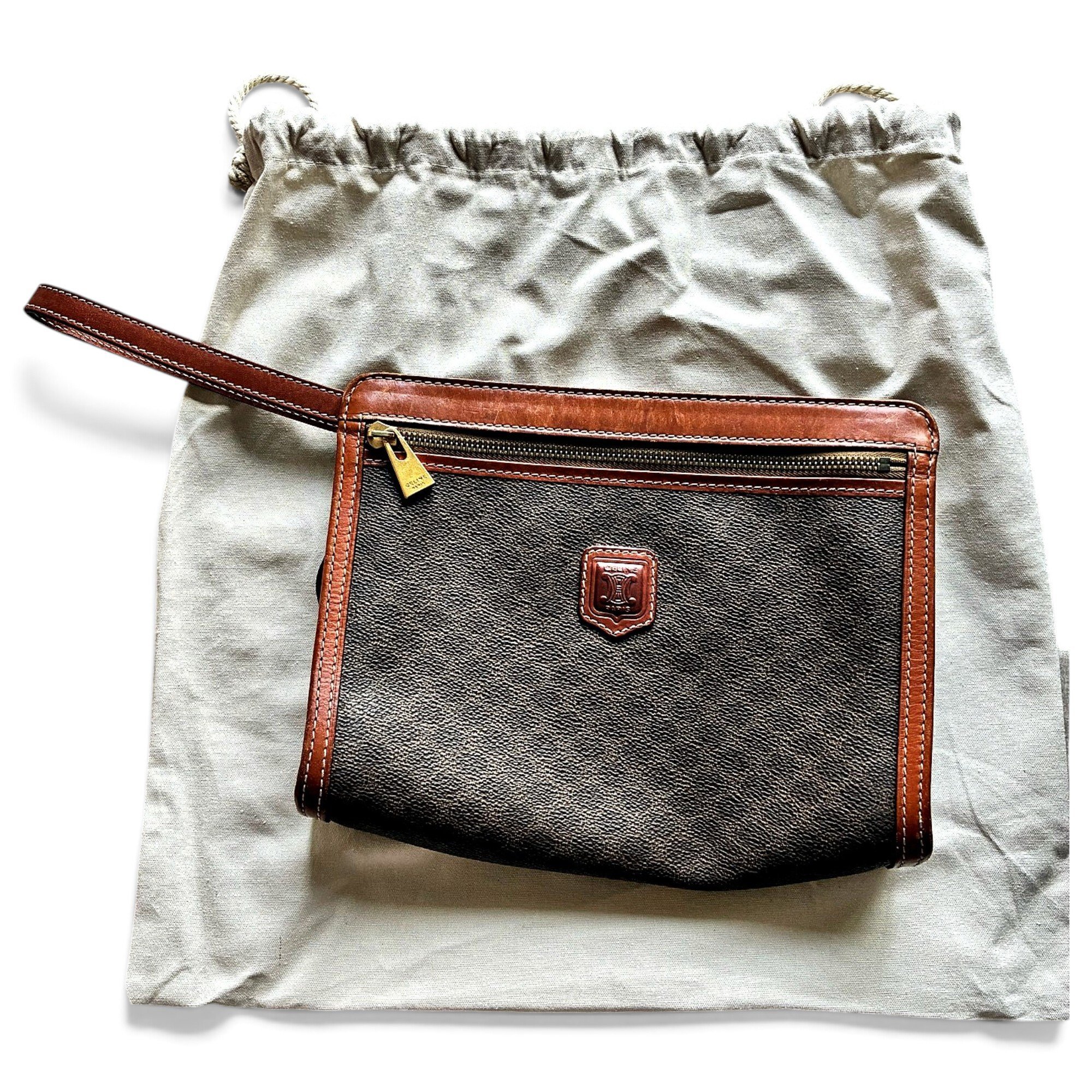 Triomphe Vintage leather clutch bag