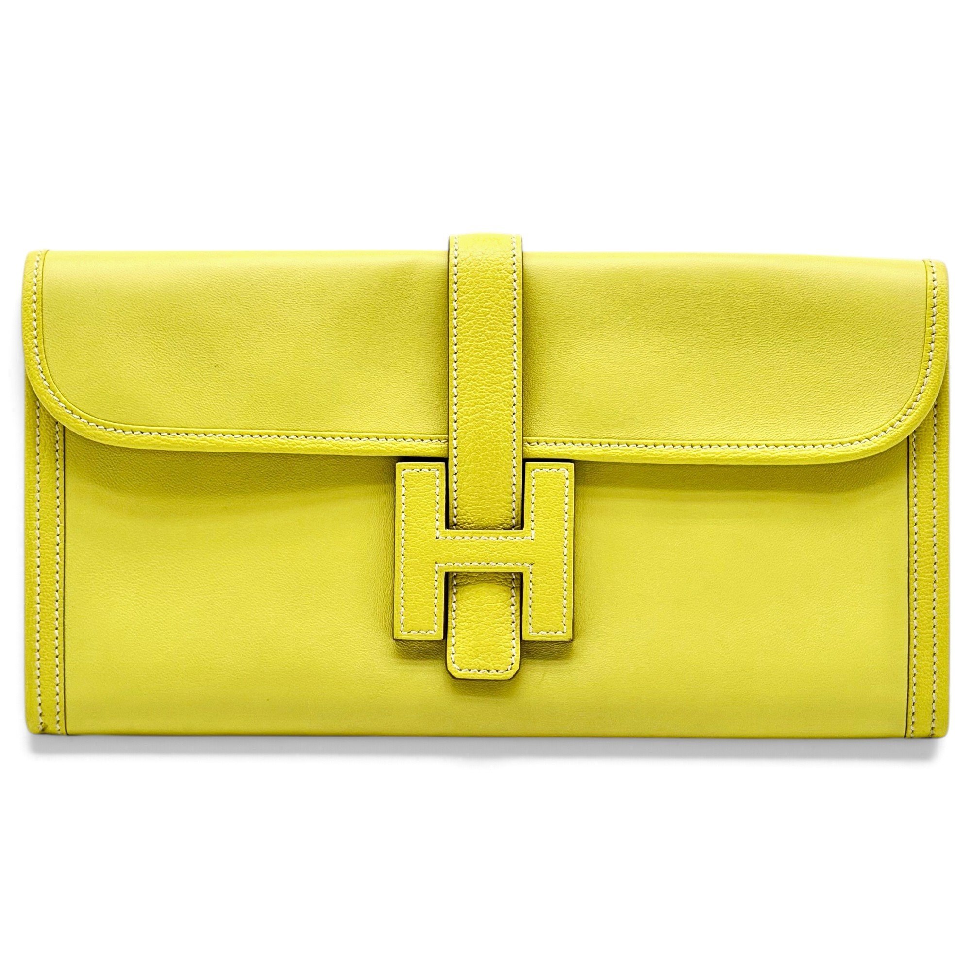 Jige leather clutch bag