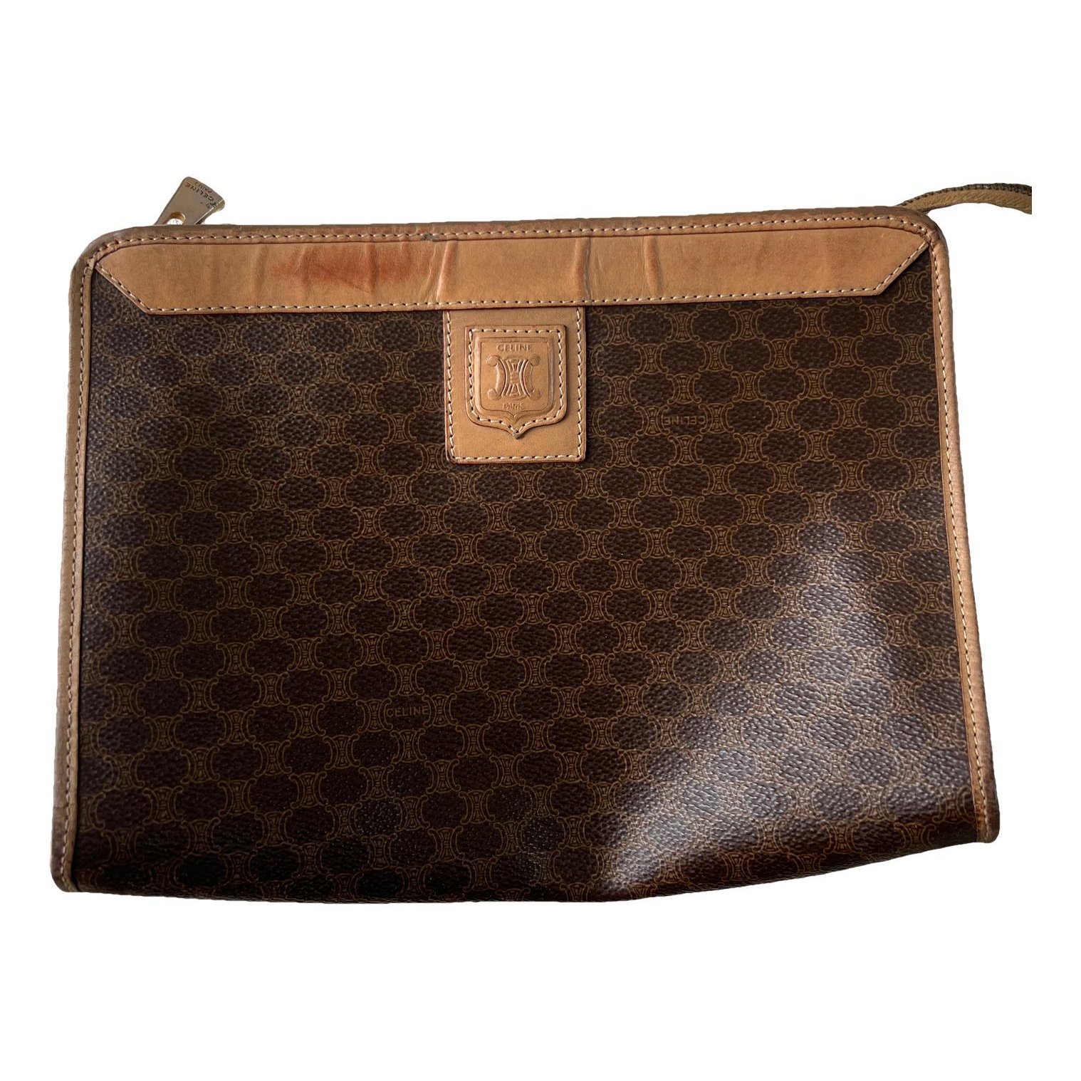 Triomphe Vintage leather clutch bag