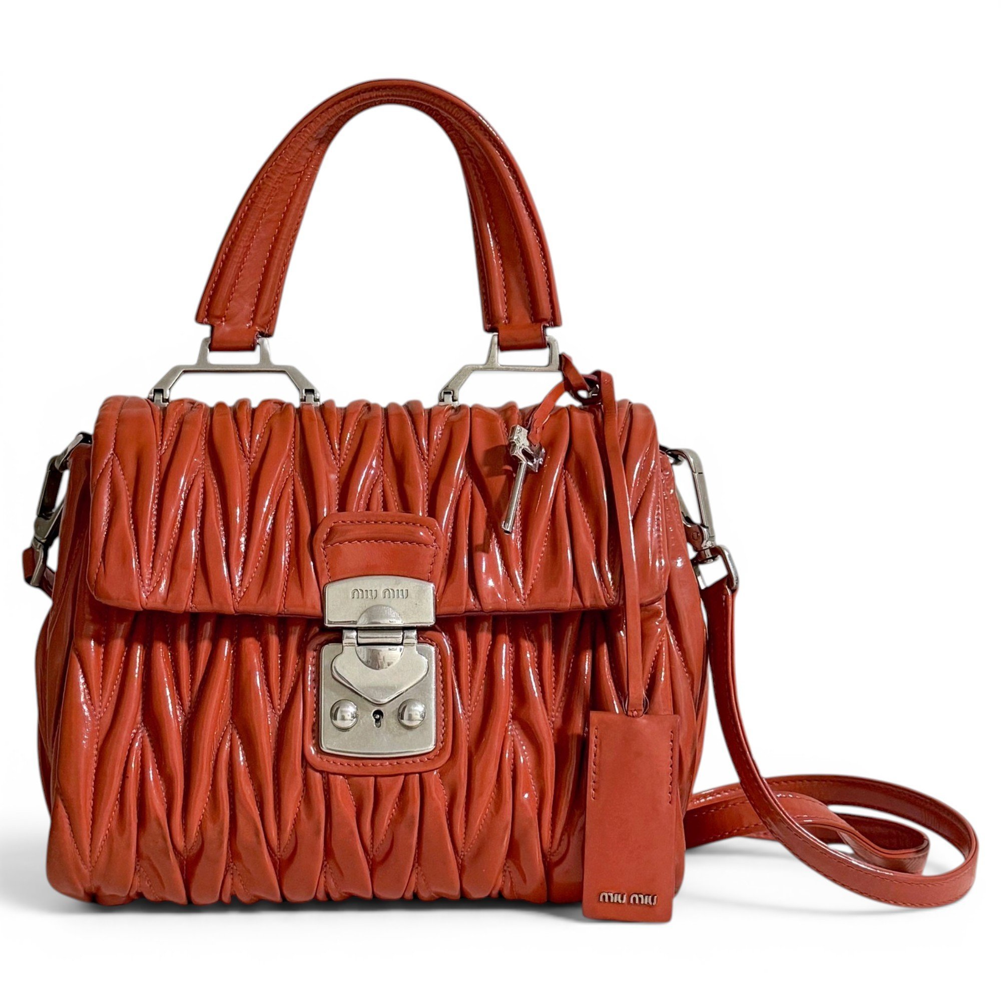 Matelassé patent leather handbag