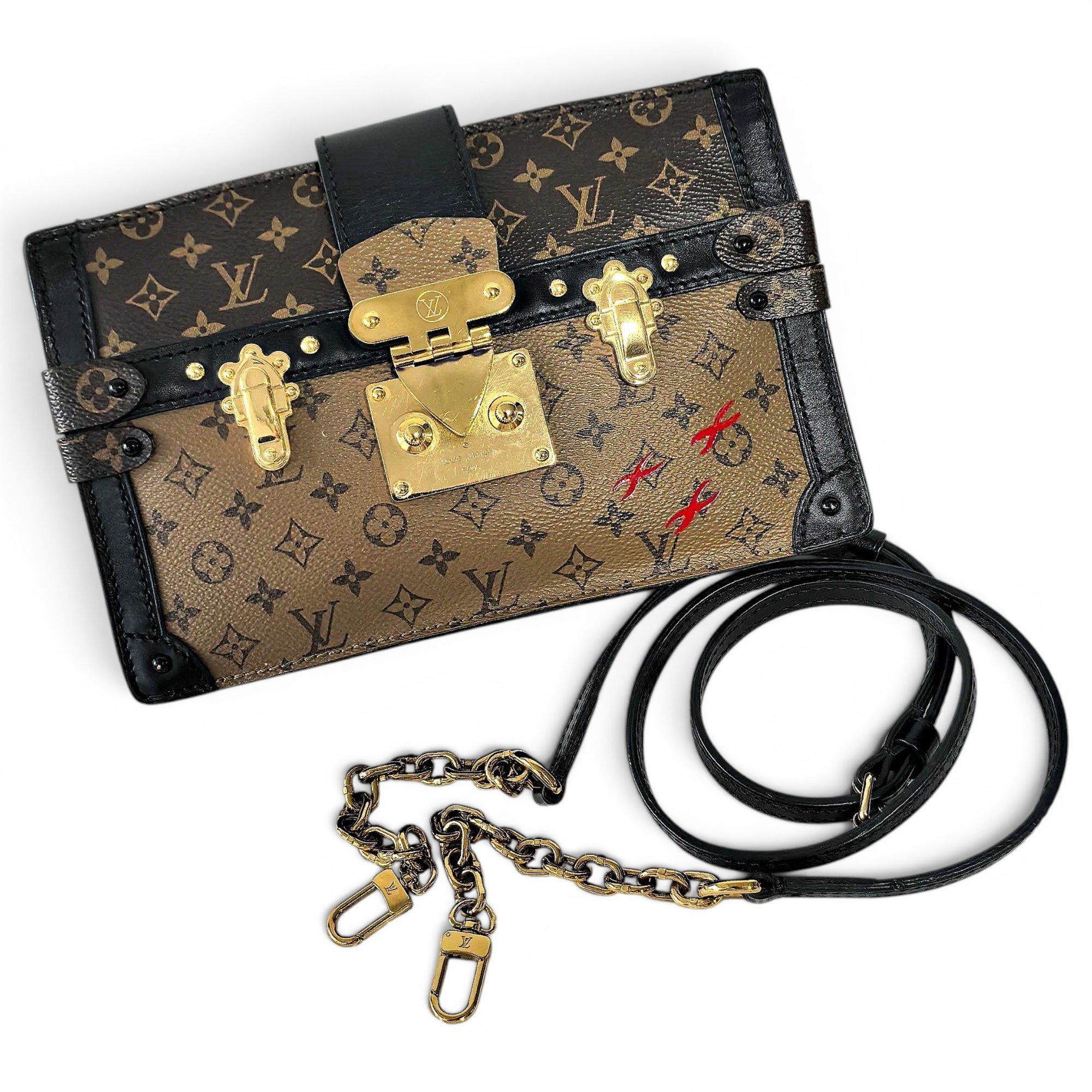 Pochette Trunk leather handbag