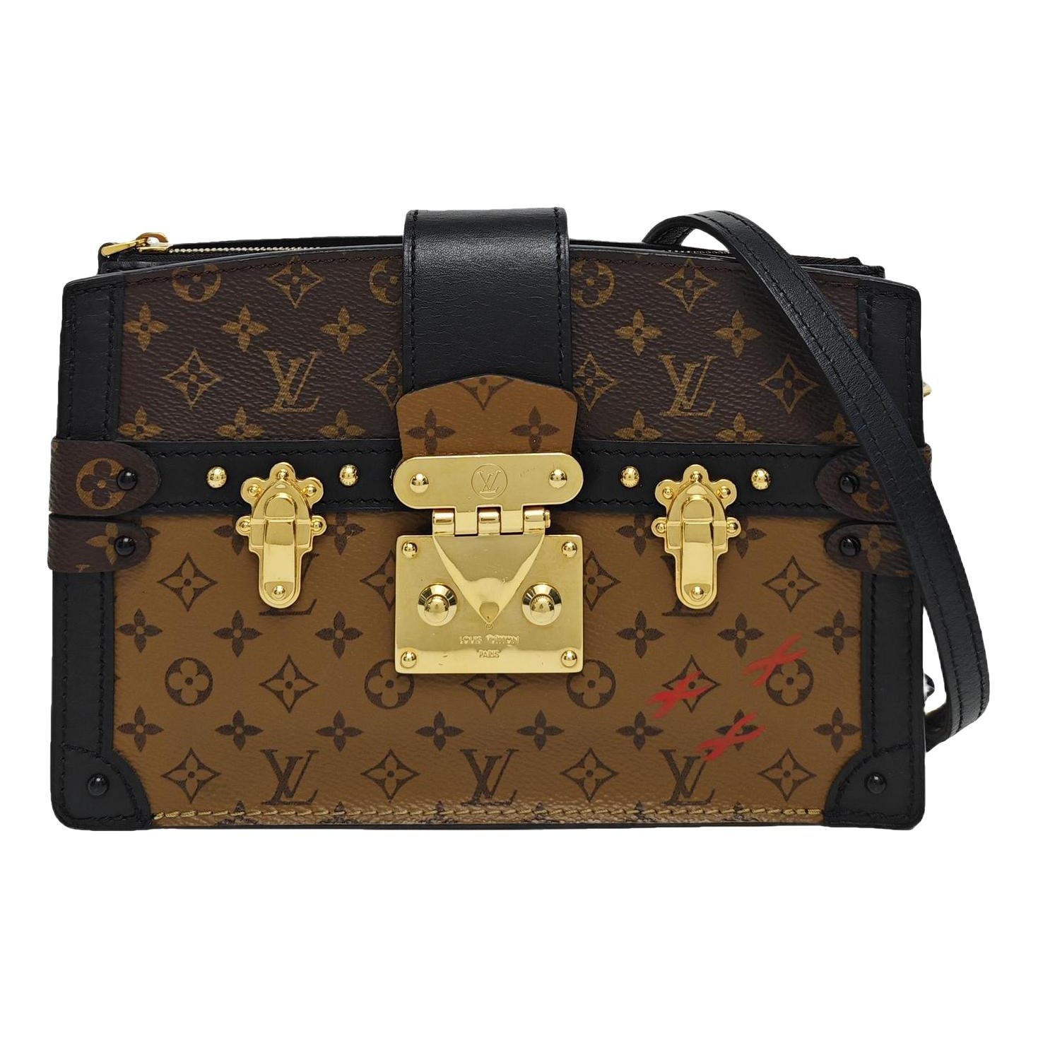 Pochette Trunk leather handbag