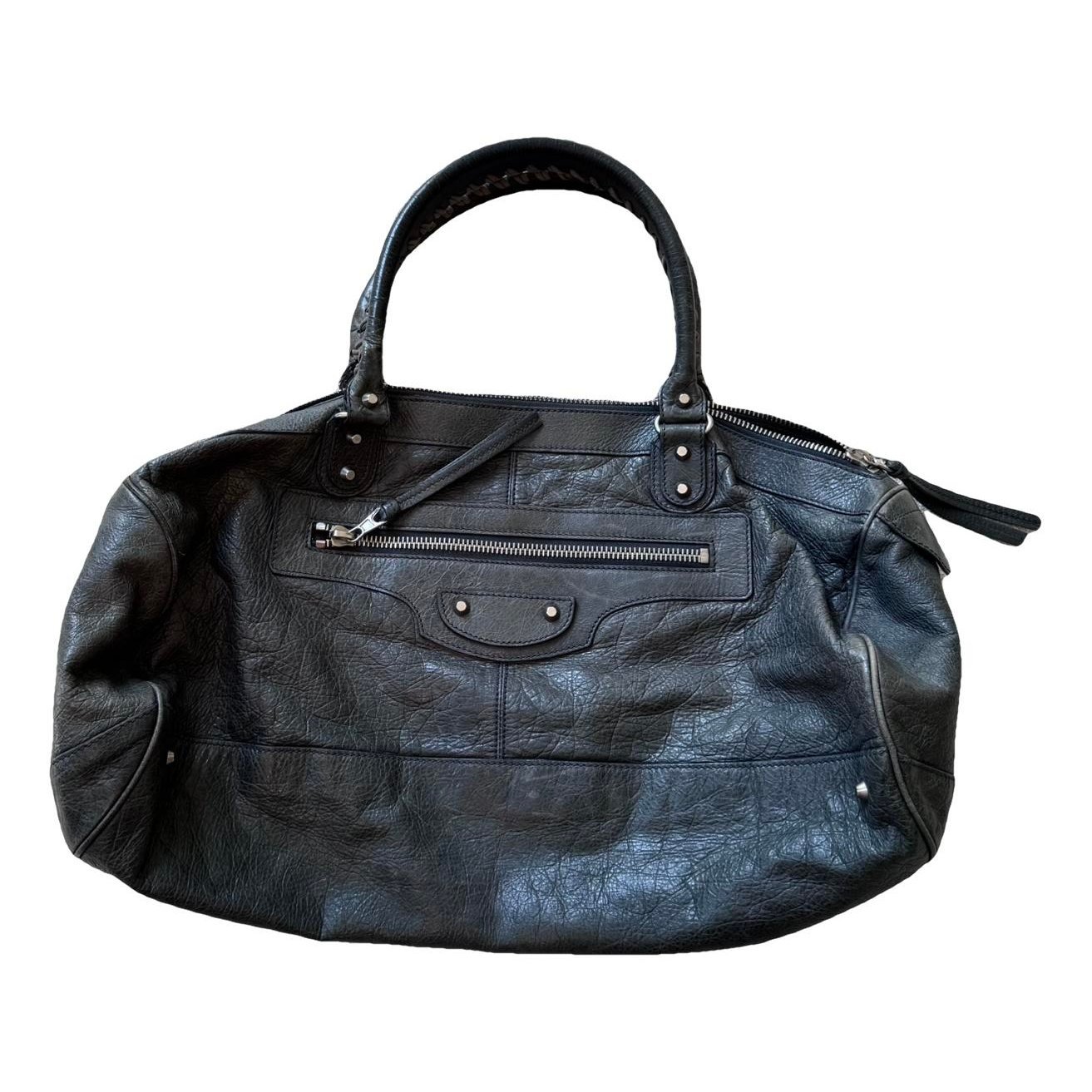 First leather handbag