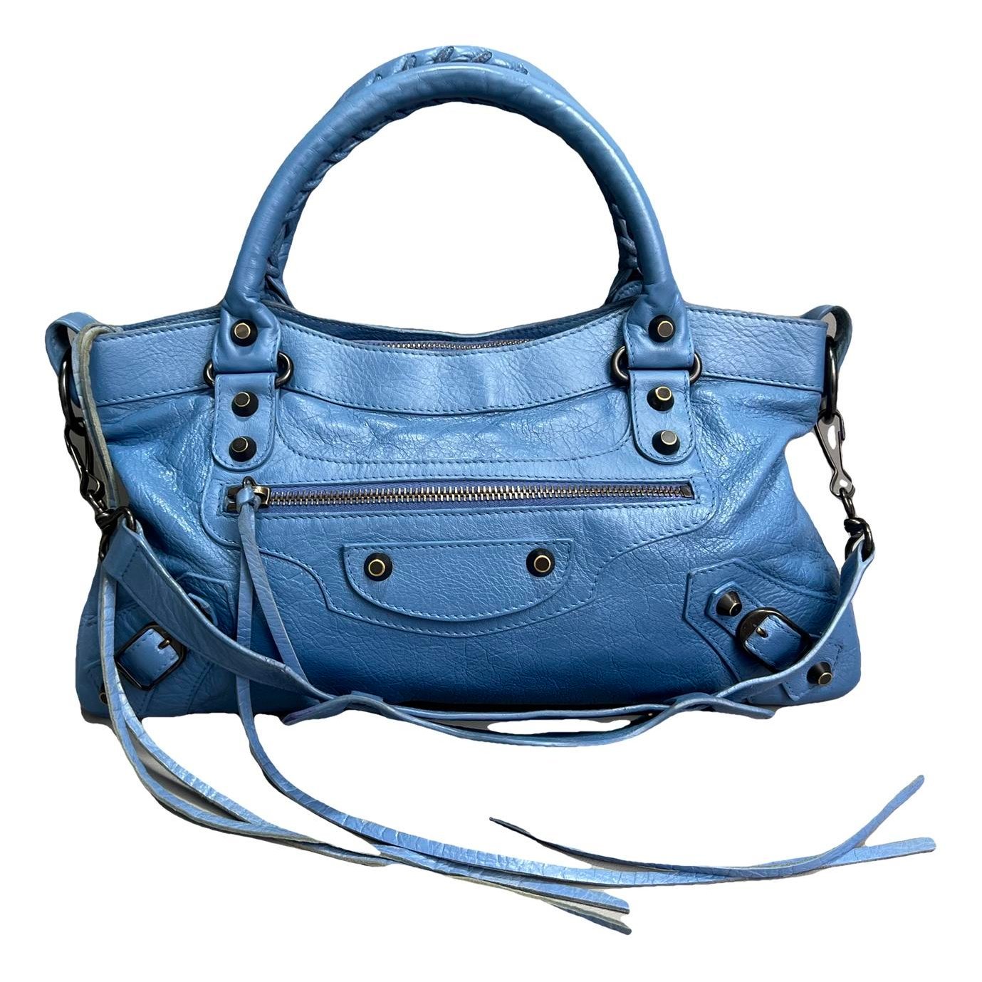 First leather handbag