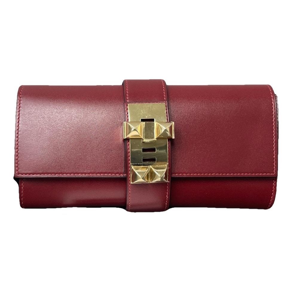 Médor leather clutch bag