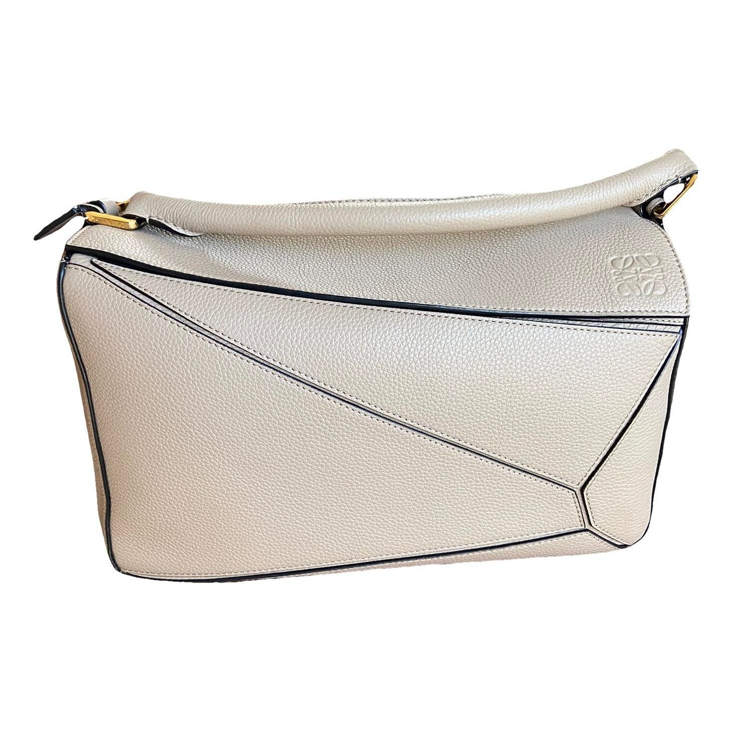 Puzzle leather handbag