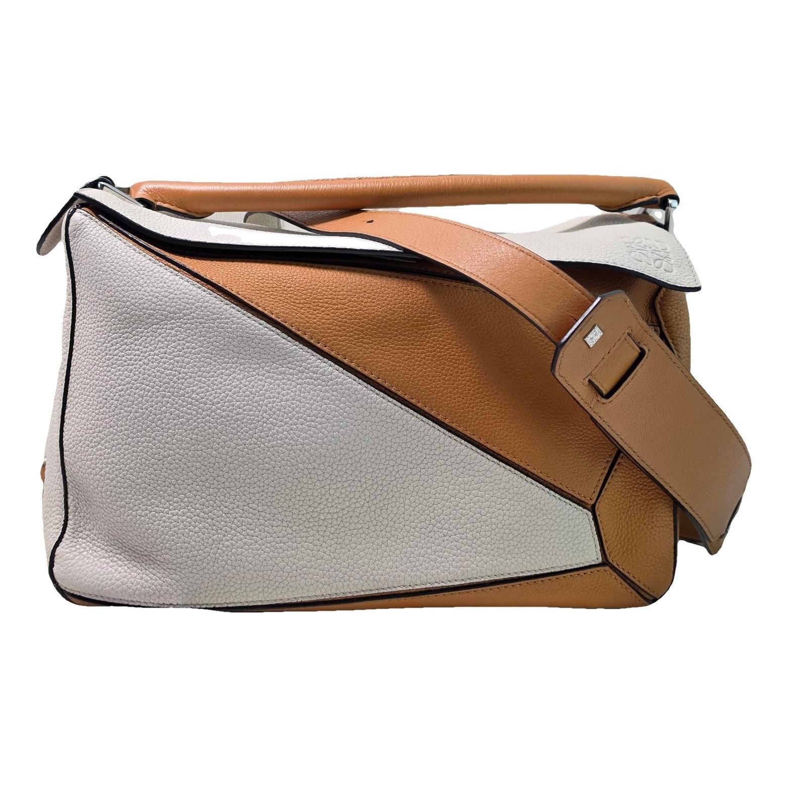 Puzzle leather handbag