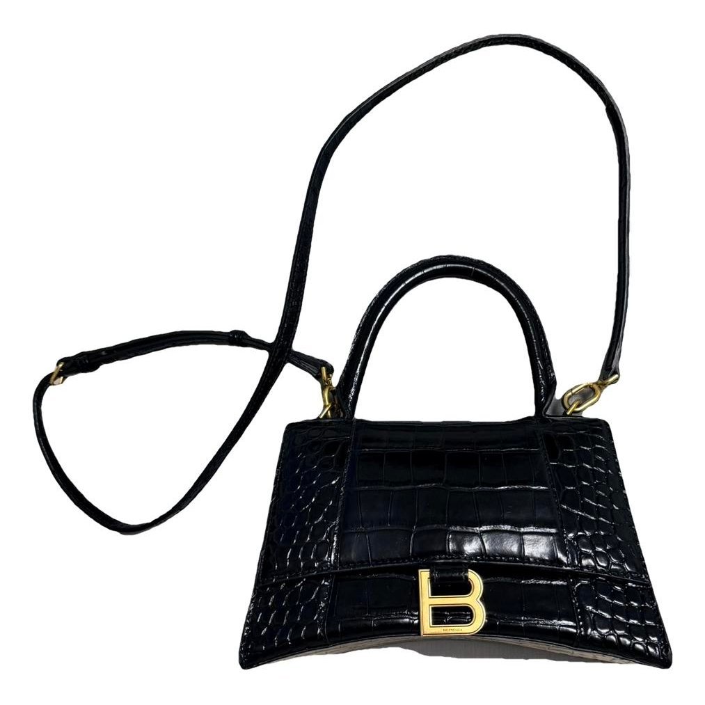 Hourglass patent leather handbag