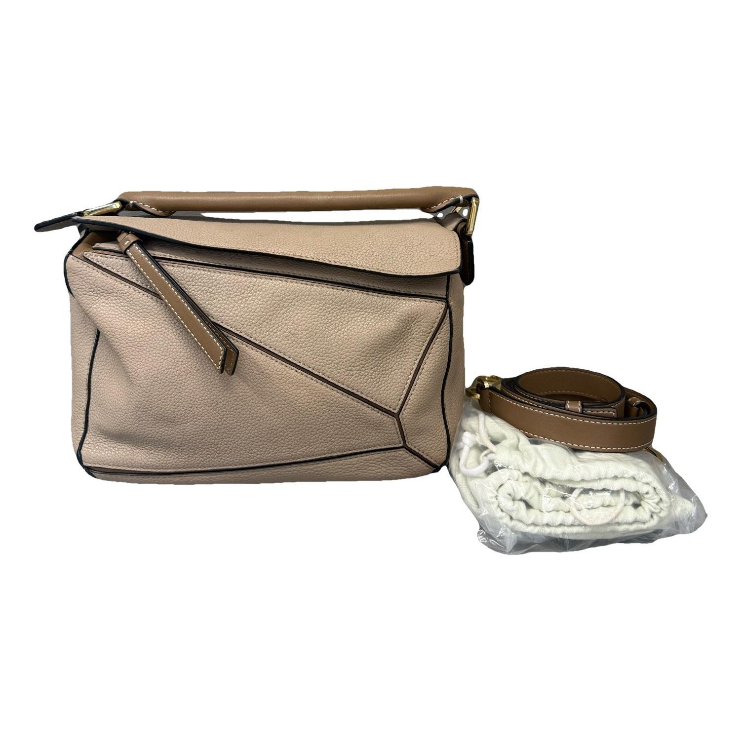 Puzzle leather handbag
