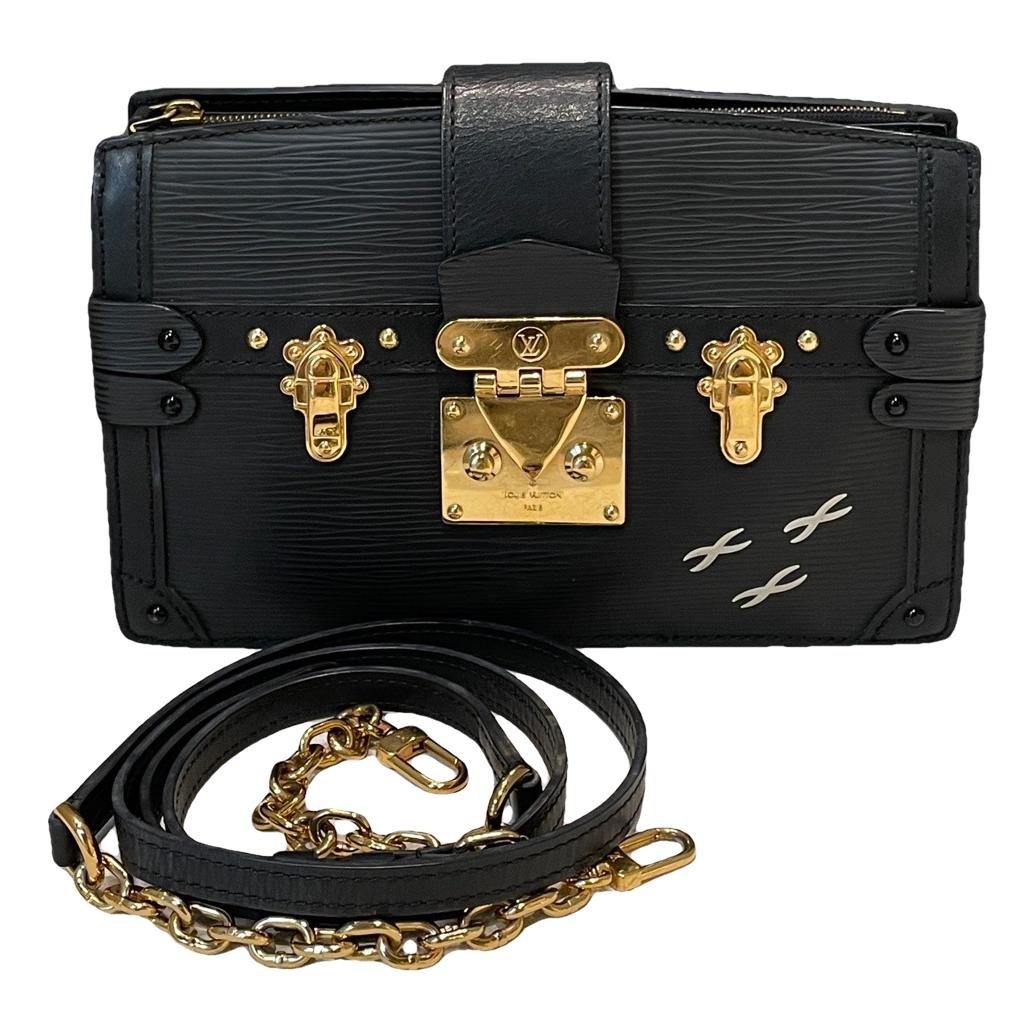 Pochette Trunk leather handbag