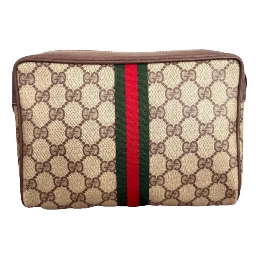 Ophidia patent leather clutch bag