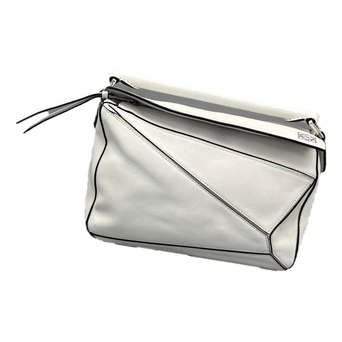 Puzzle leather handbag