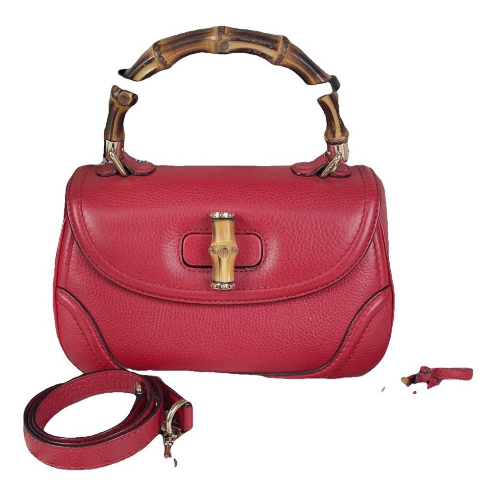Convertible Pompon Bamboo Top Handle leather handbag