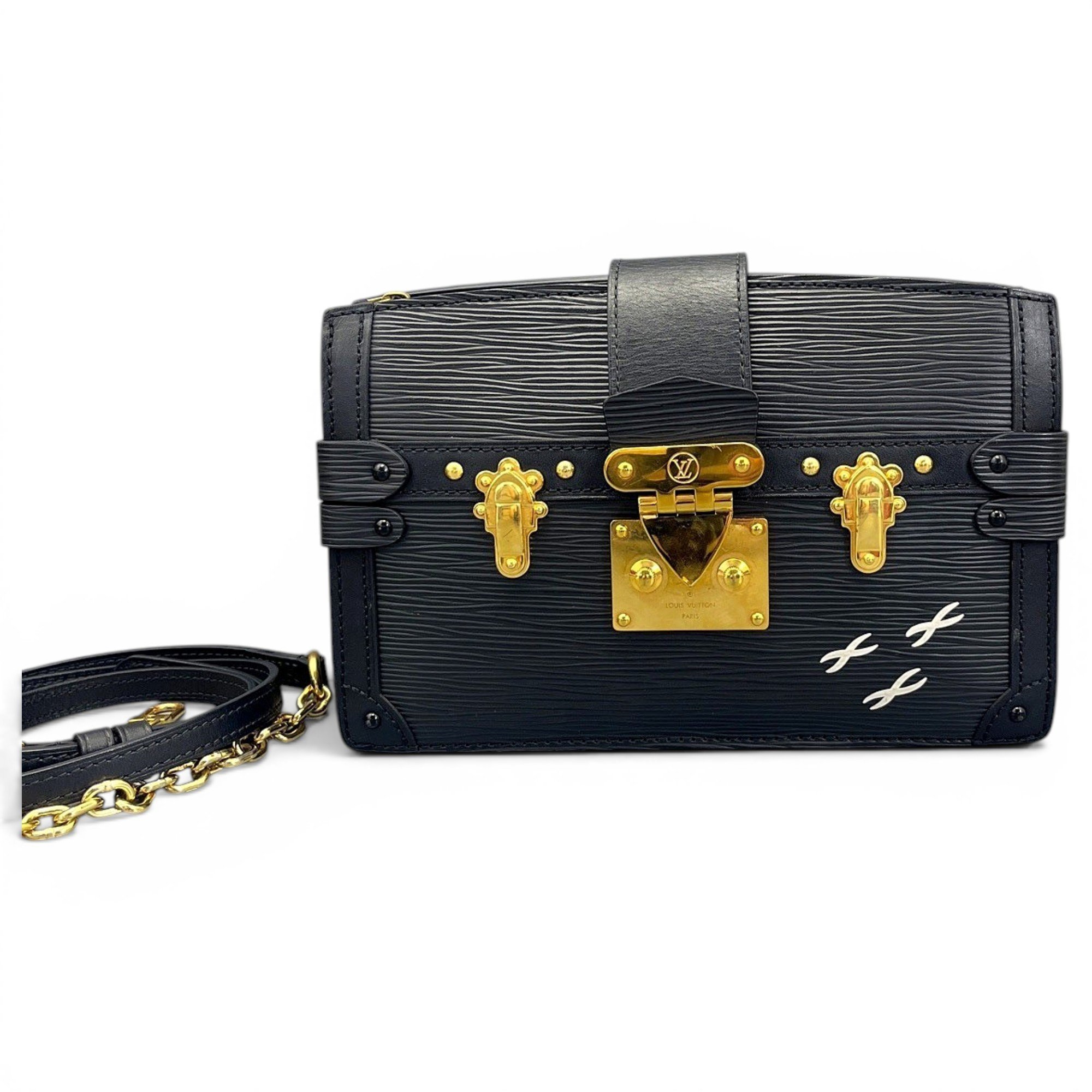 Pochette Trunk leather handbag