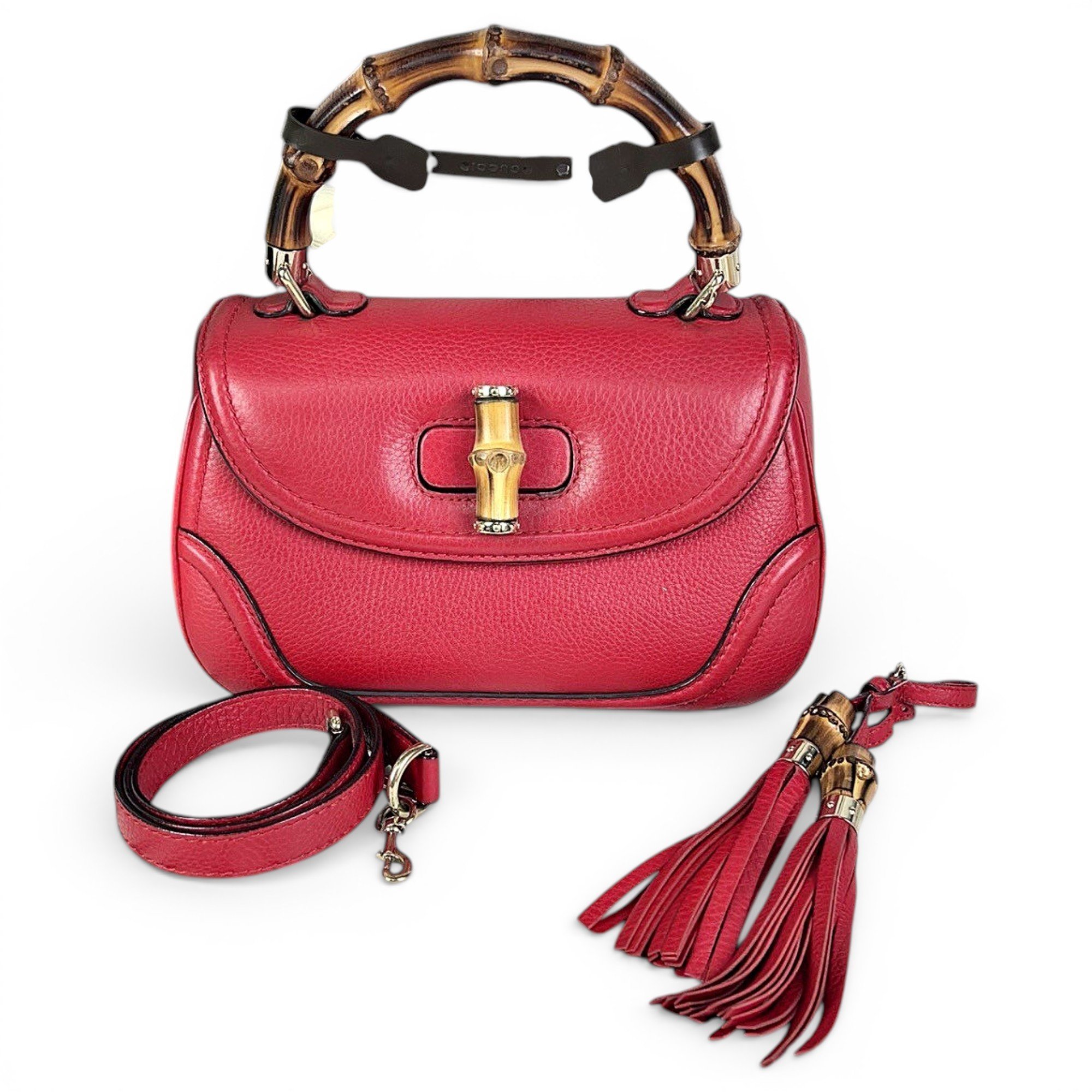 Convertible Pompon Bamboo Top Handle leather handbag