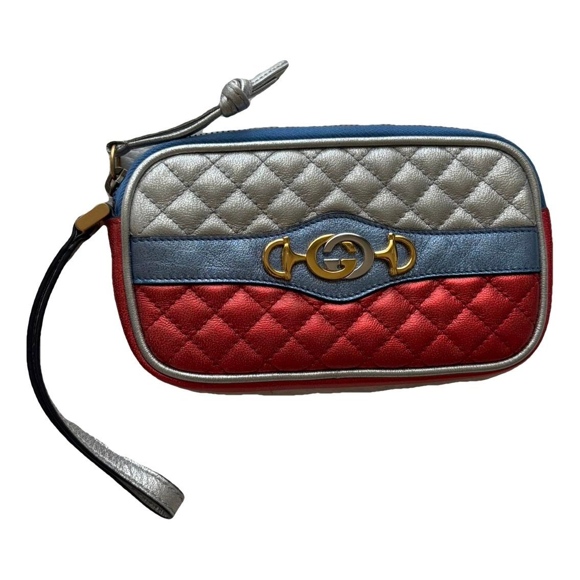 Laminated leather clutch bag