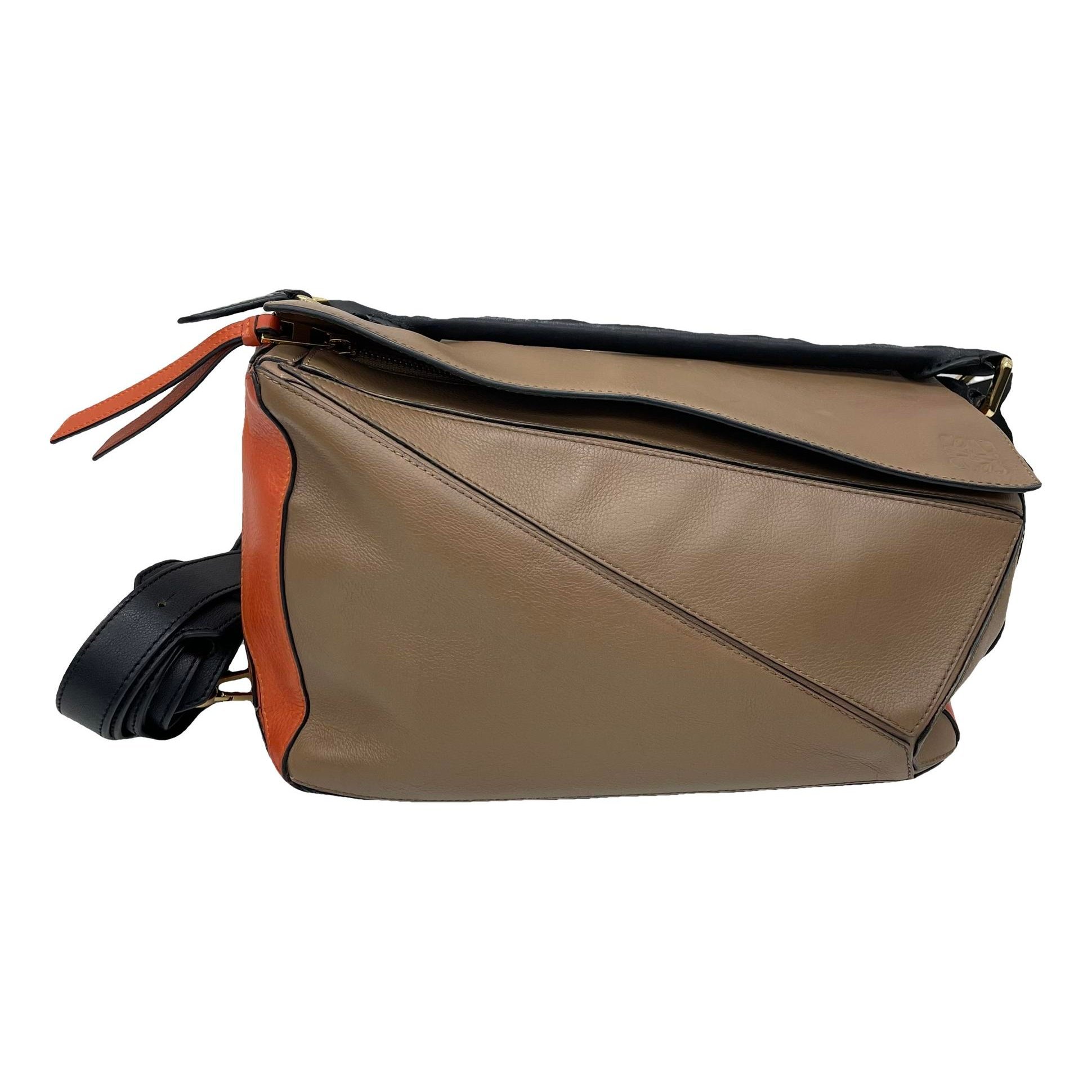 Puzzle leather handbag