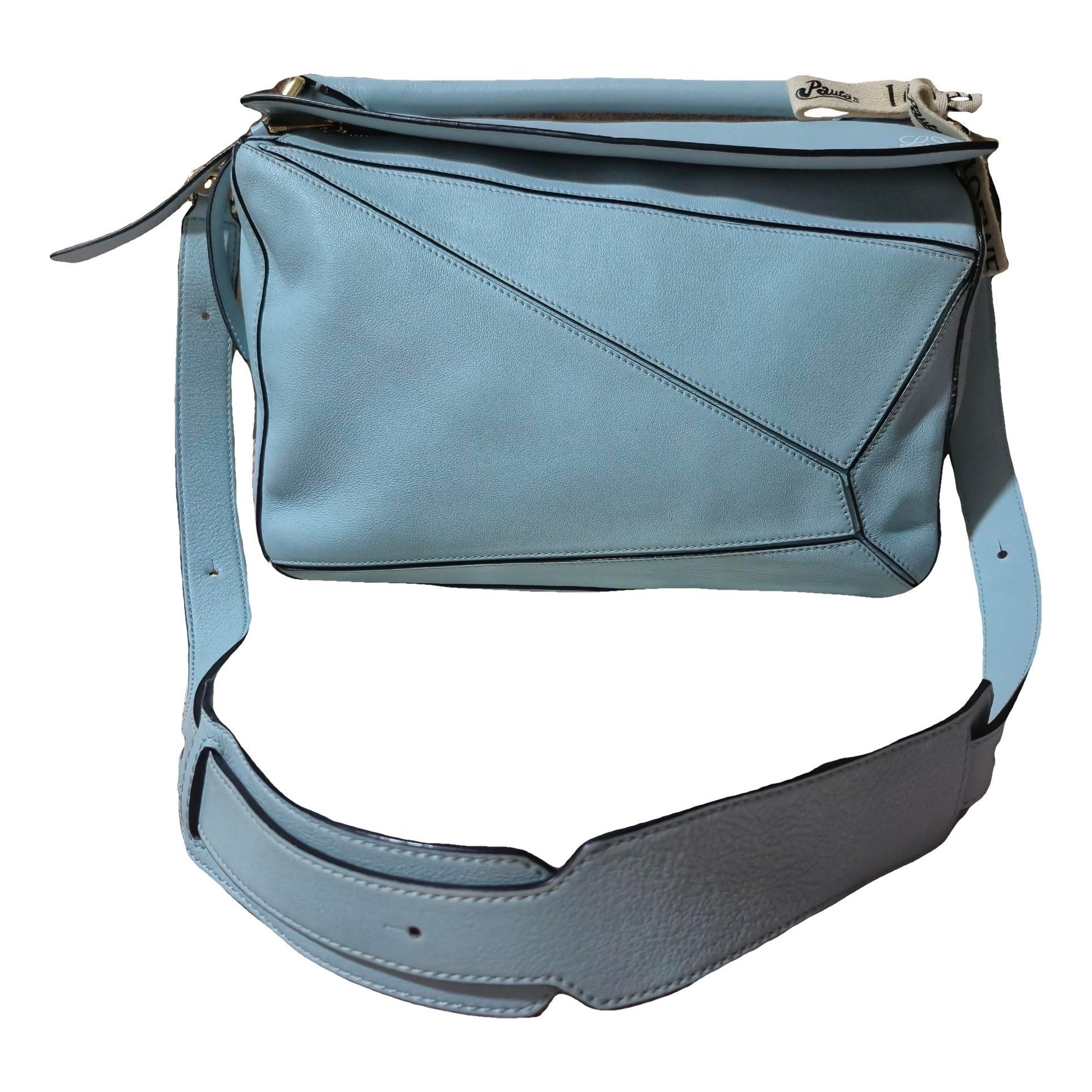 Puzzle leather handbag