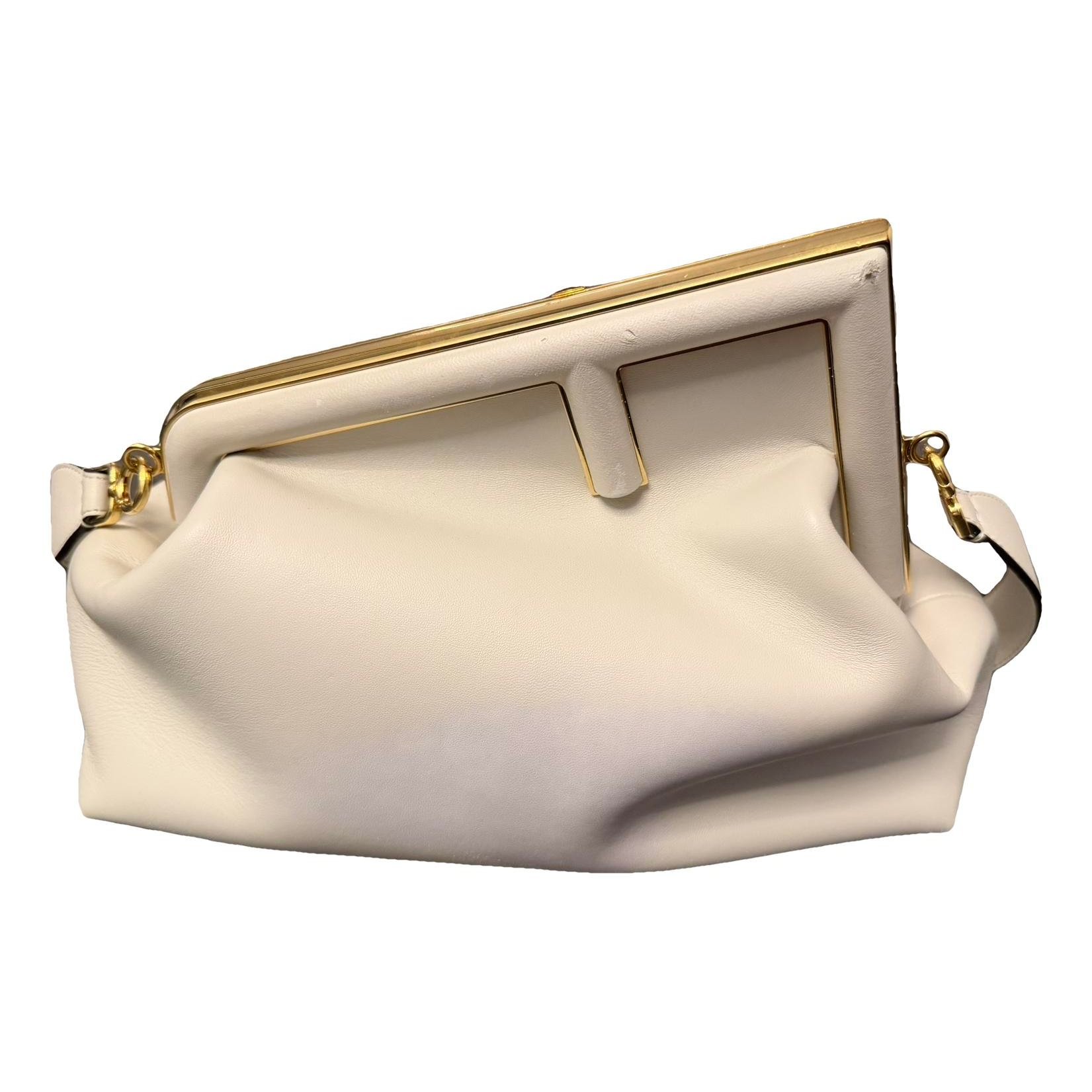First leather handbag