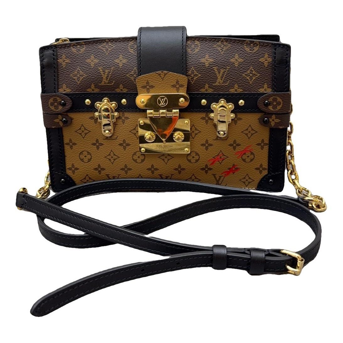 Pochette Trunk leather handbag