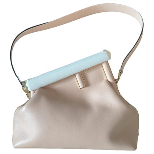 First leather handbag